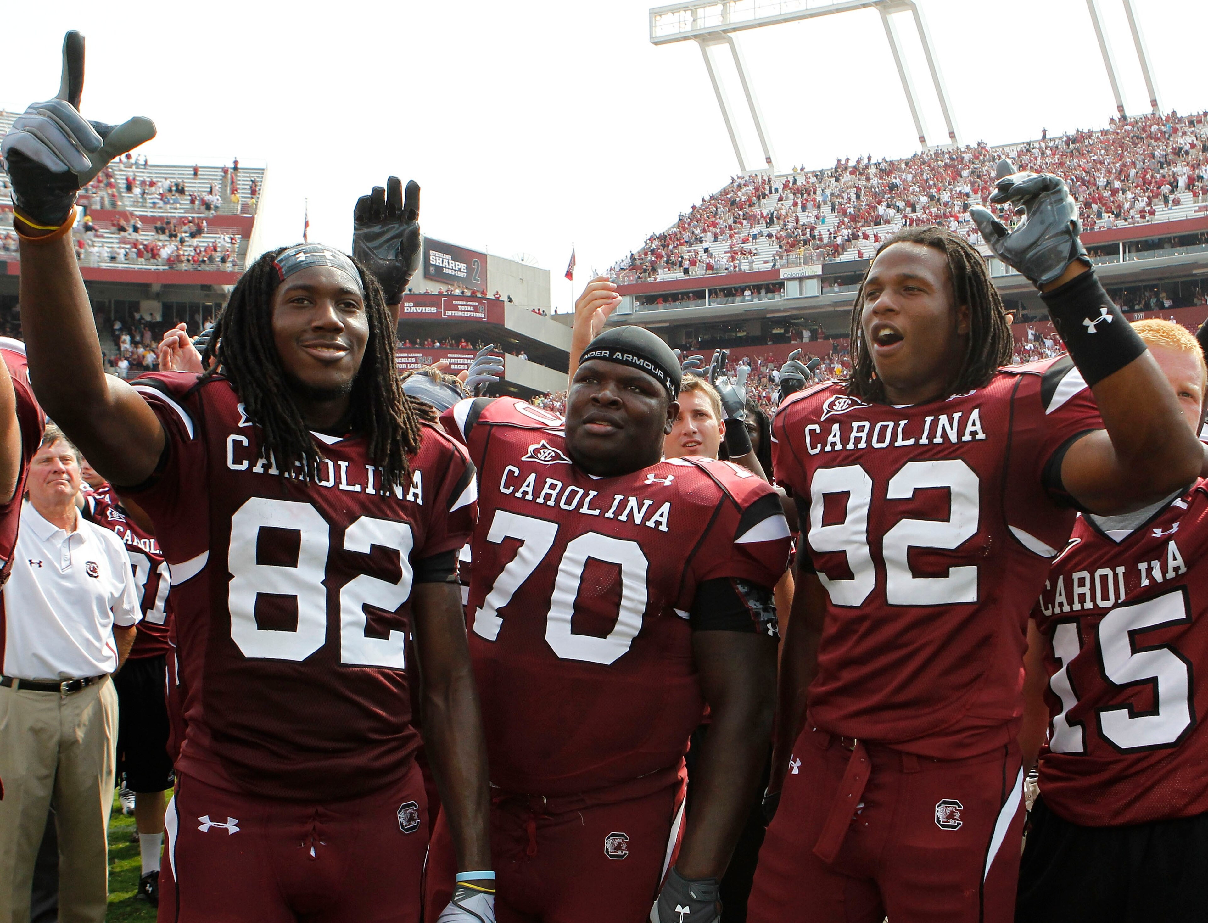 COLUMBIA, SC - SEPTEMBER 11: Tackle Byron Jerideau #70 (center), wide receiver D.L. Moore #82 (left) and defensive end Byron McKnight #92 (right) of the South Carolina Gamecocks during the game against the Georgia Bulldogs at Williams-Brice Stadium on Sep COLUMBIA, SC - SEPTEMBER 11: Tackle Byron Jerideau #70 (center), wide receiver D.L. Moore #82 (left) and defensive end Byron McKnight #92 (right) of the South Carolina Gamecocks during the game against the Georgia Bulldogs at Williams-Brice Stadium on Sep