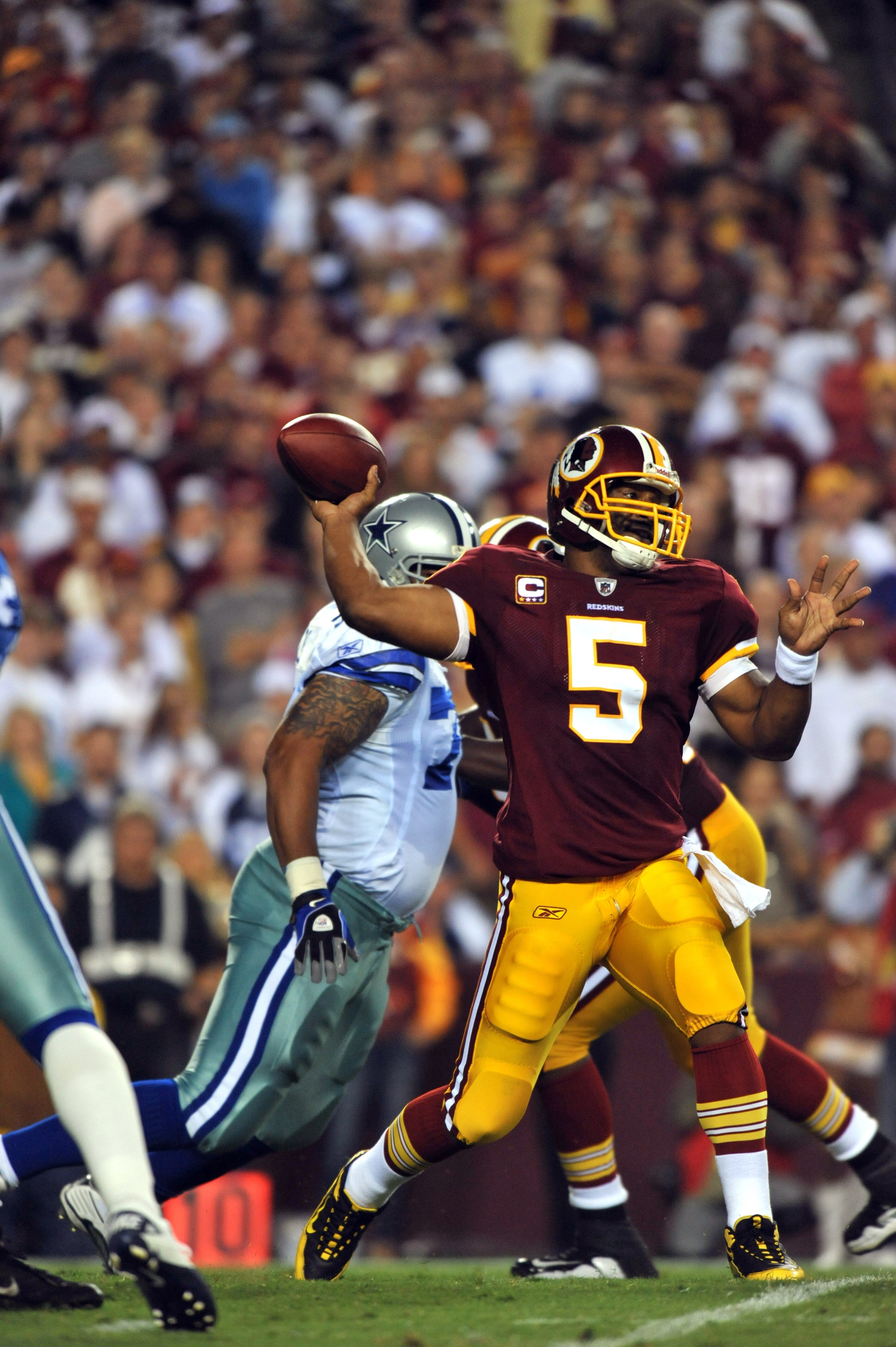 LANDOVER - SEPTEMBER 12: Donovan McNabb #5 of the Washington Redskins passes during the NFL season opener against the Dallas Cowboys at FedExField on September 12, 2010 in Landover, Maryland. (Photo by Larry French/Getty Images) LANDOVER - SEPTEMBER 12: Donovan McNabb #5 of the Washington Redskins passes during the NFL season opener against the Dallas Cowboys at FedExField on September 12, 2010 in Landover, Maryland. (Photo by Larry French/Getty Images)