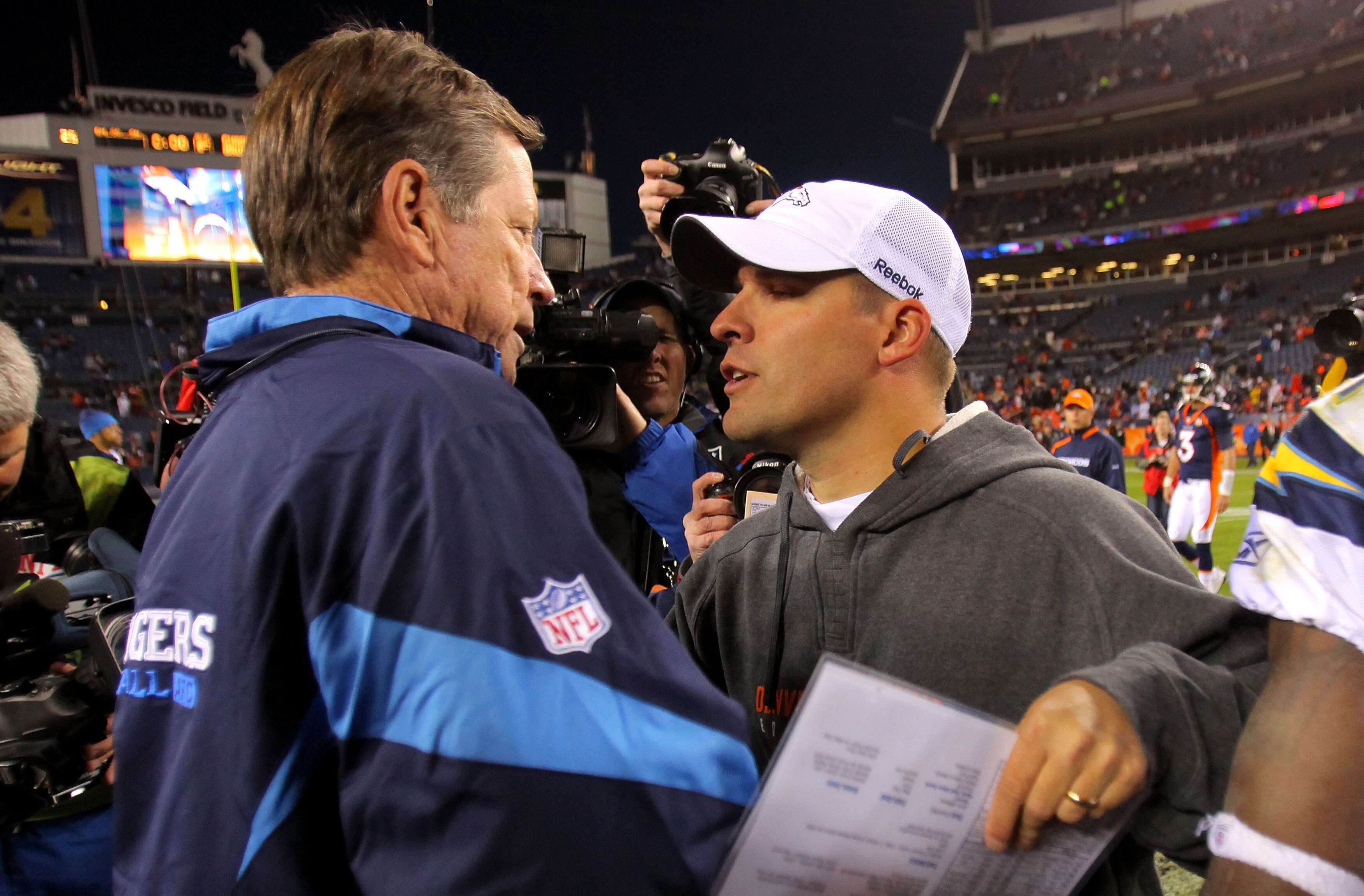 DENVER - NOVEMBER 22:  Head coach Norv Turner (L) of the San Diego Chargers and head coach Josh McDaniels (R) of the Denver Broncos meet and greet at midfield after the game during NFL action at Invesco Field at Mile High on November 22, 2009 in Denver, C