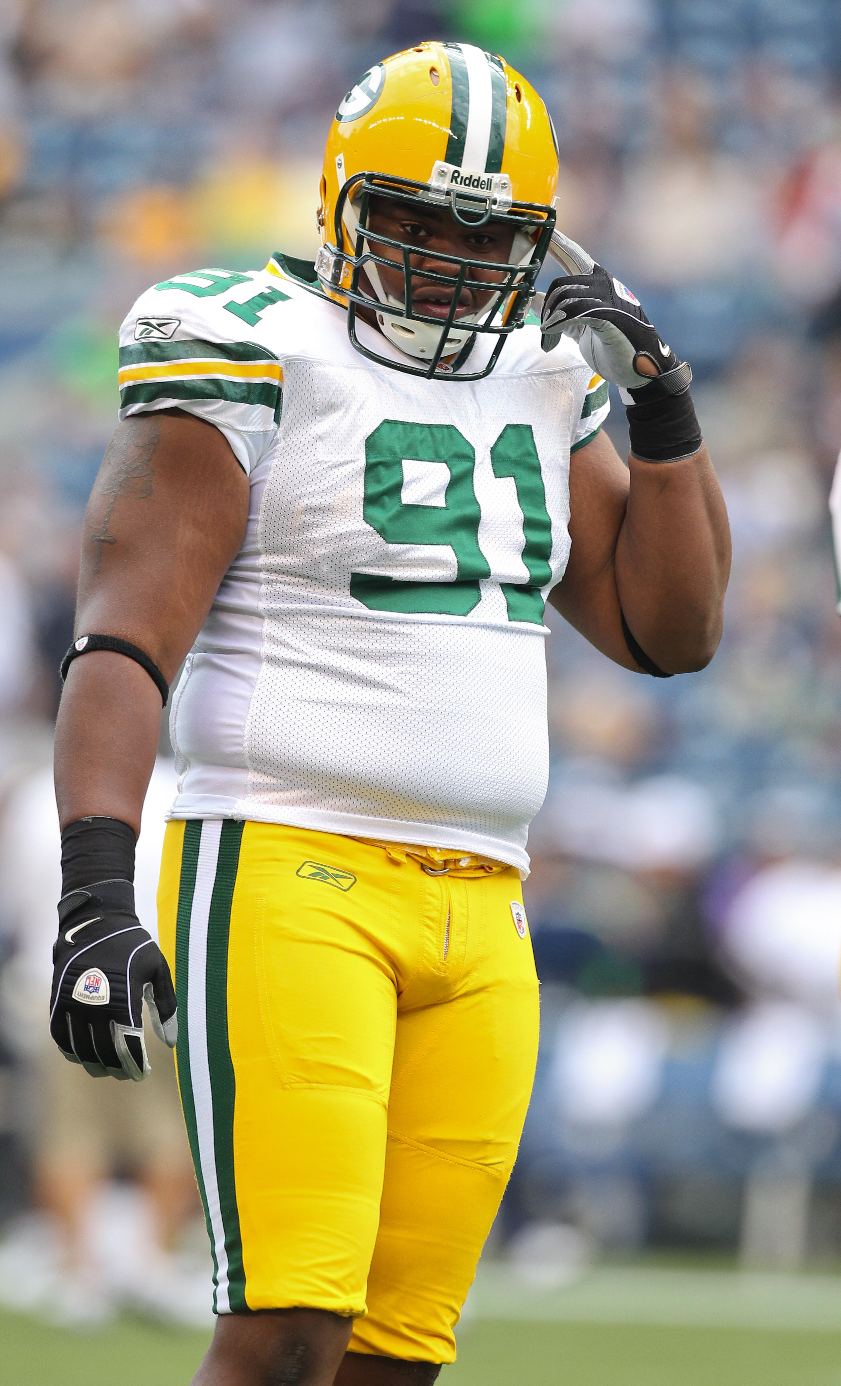 SEATTLE - AUGUST 21: Defensive end Justin Harrell #91 of the Green Bay Packers looks on during warmups prior to the preseason game against the Seattle Seahawks at Qwest Field on August 21, 2010 in Seattle, Washington. (Photo by Otto Greule Jr/Getty Image SEATTLE - AUGUST 21: Defensive end Justin Harrell #91 of the Green Bay Packers looks on during warmups prior to the preseason game against the Seattle Seahawks at Qwest Field on August 21, 2010 in Seattle, Washington. (Photo by Otto Greule Jr/Getty Image