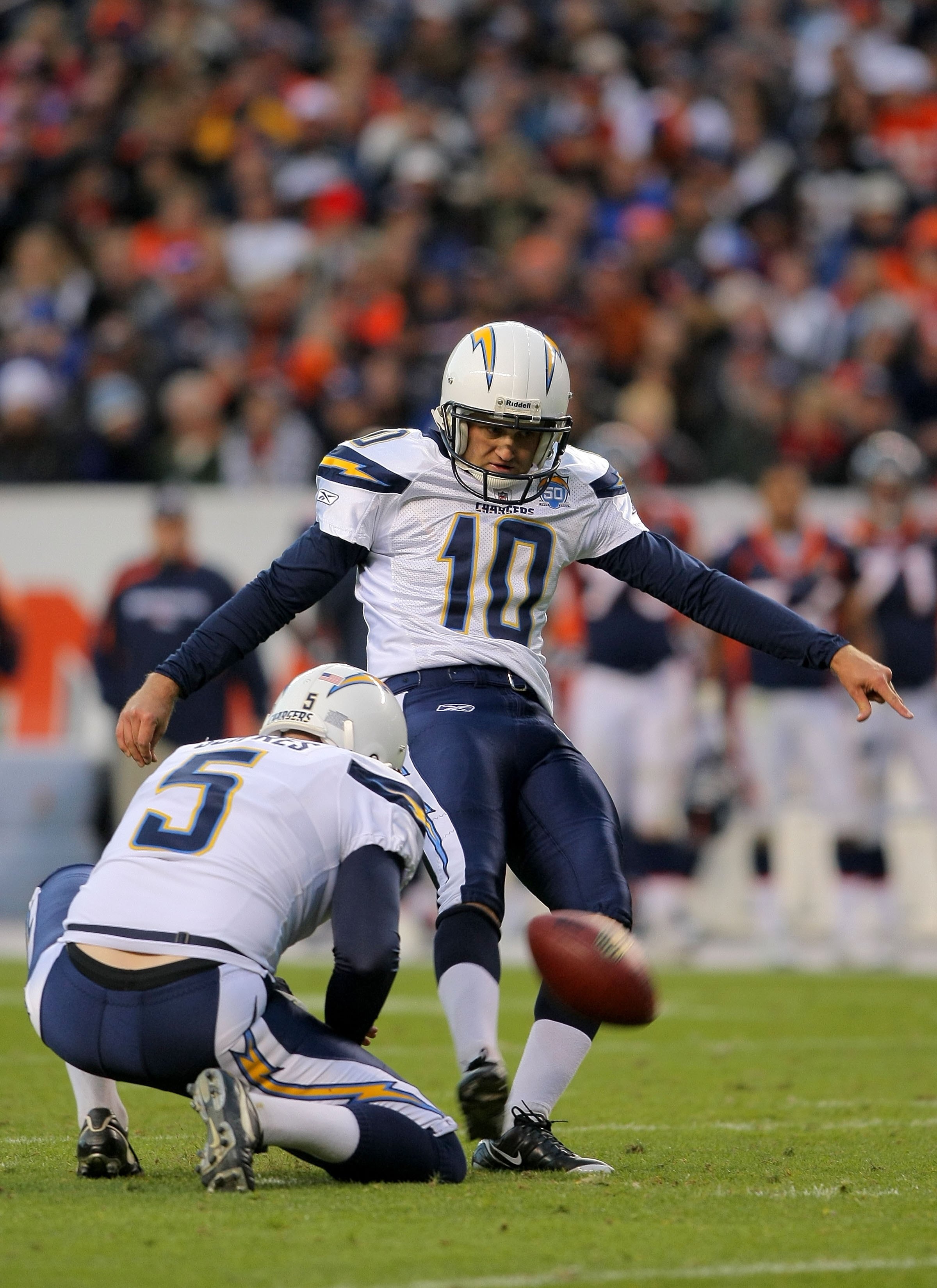 DENVER - NOVEMBER 22:  Nate Kaeding #10 of the San Diego Chargers kicks a field goal from the hold of Mike Scifres #5 against the Denver Broncos during NFL action at Invesco Field at Mile High on November 22, 2009 in Denver, Colorado. Kaeding made four fi