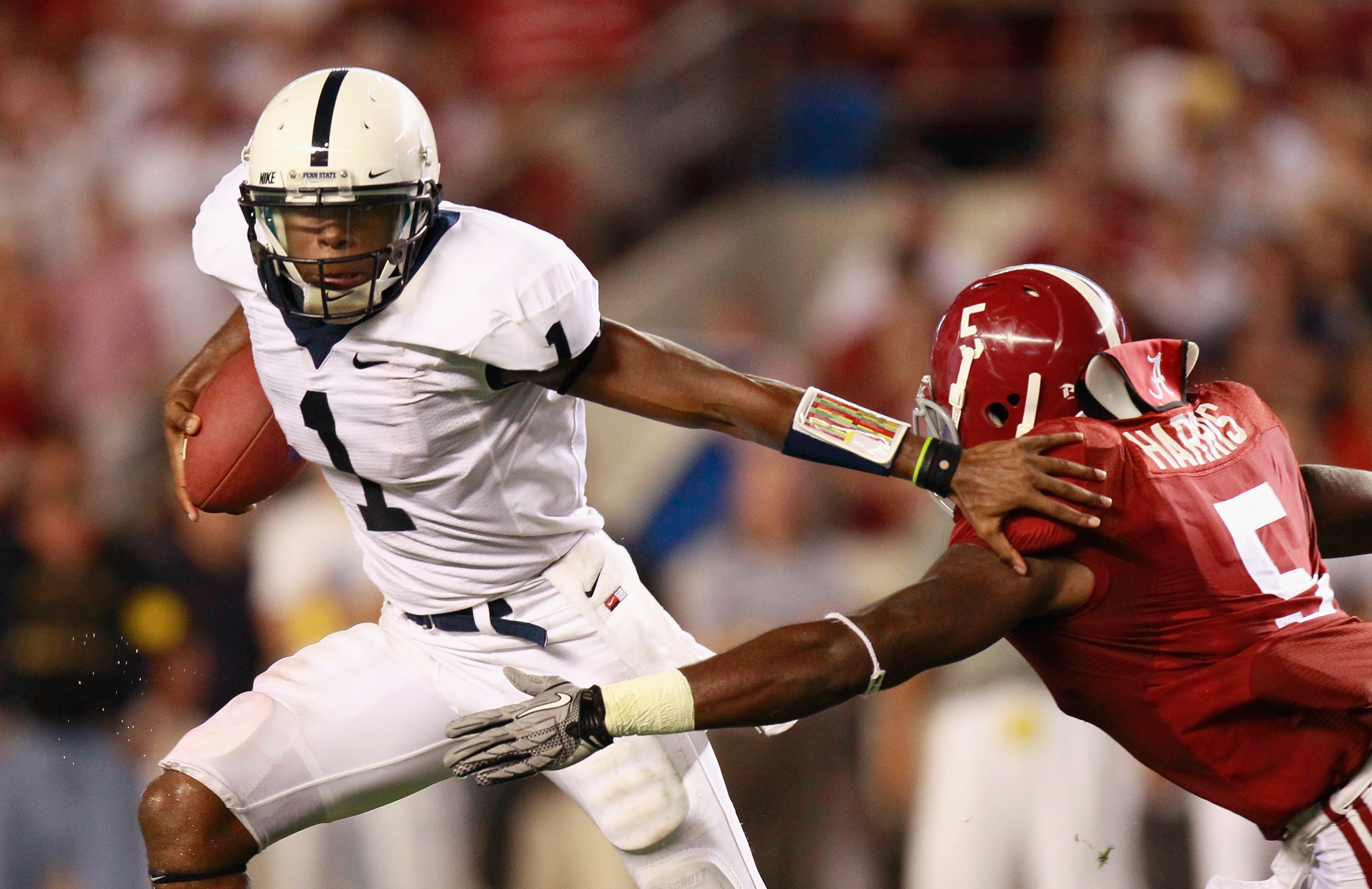 TUSCALOOSA, AL - SEPTEMBER 11:  Quarterback Robert Bolden #1 of the Penn State Nittany Lions stiff arms Jerrell Harris #5 of the Alabama Crimson Tide at Bryant-Denny Stadium on September 11, 2010 in Tuscaloosa, Alabama.  (Photo by Kevin C. Cox/Getty Image