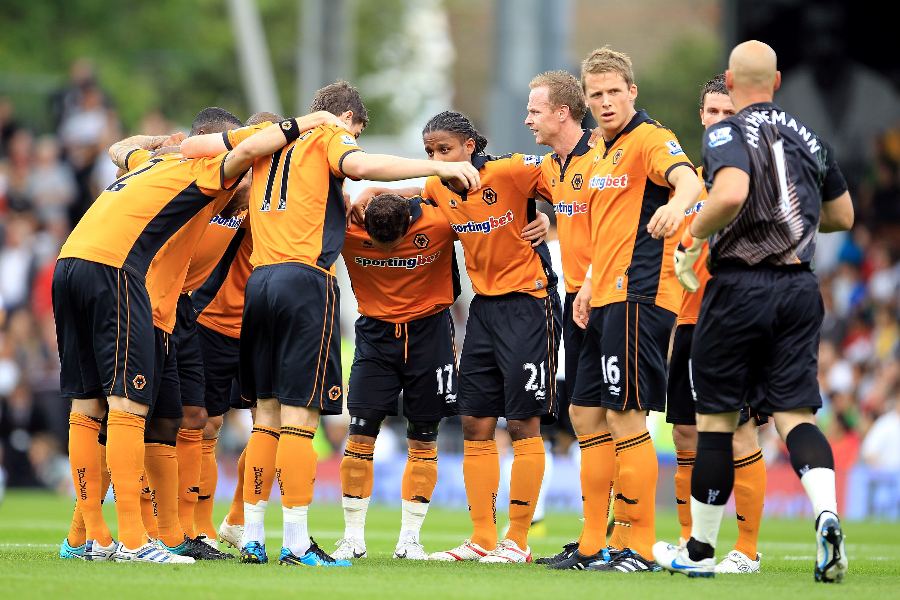 LONDON, ENGLAND - SEPTEMBER 11: The Wolves players await the arrival of their goalkeeper Marcus Hanneman for their pre-match huddle during the Barclays Premier League match between Fulham and Wolverhampton Wanderers at Craven Cottage on September 11, 201 LONDON, ENGLAND - SEPTEMBER 11: The Wolves players await the arrival of their goalkeeper Marcus Hanneman for their pre-match huddle during the Barclays Premier League match between Fulham and Wolverhampton Wanderers at Craven Cottage on September 11, 201
