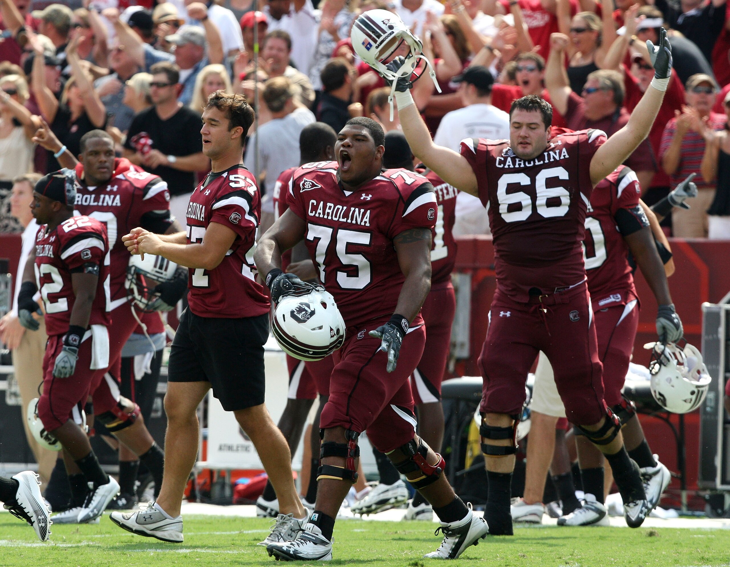 COLUMBIA, SC - SEPTEMBER 11: Members of the South Carolina Gamecocks team, including guard Steven Singleton #75 and tacklet Hutch Eckerson #66, run on the field after the game against the Georgia Bulldogs at Williams-Brice Stadium on September 11, 2010 in