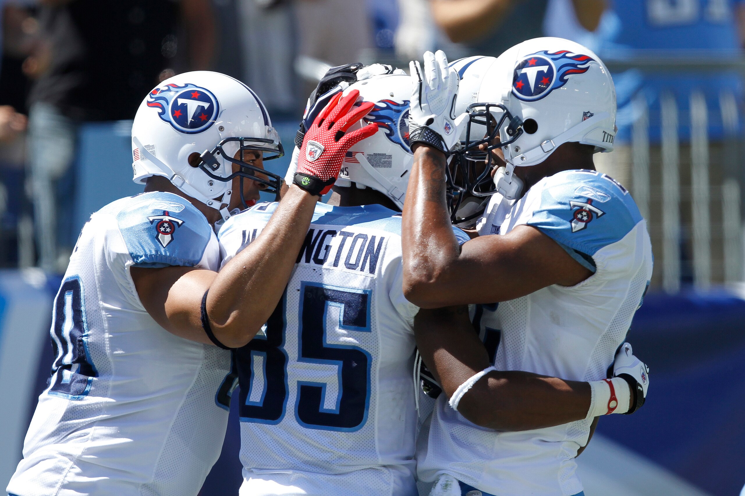NASHVILLE - SEPTEMBER 12: Nate Washington #85 of the Tennessee Titans celebrates his touchdown catch with Bo Scaife #80 and Justin Gage #12 against the Oakland Raiders during the NFL season opener at LP Field on September 12, 2010 in Nashville, Tennessee. NASHVILLE - SEPTEMBER 12: Nate Washington #85 of the Tennessee Titans celebrates his touchdown catch with Bo Scaife #80 and Justin Gage #12 against the Oakland Raiders during the NFL season opener at LP Field on September 12, 2010 in Nashville, Tennessee.
