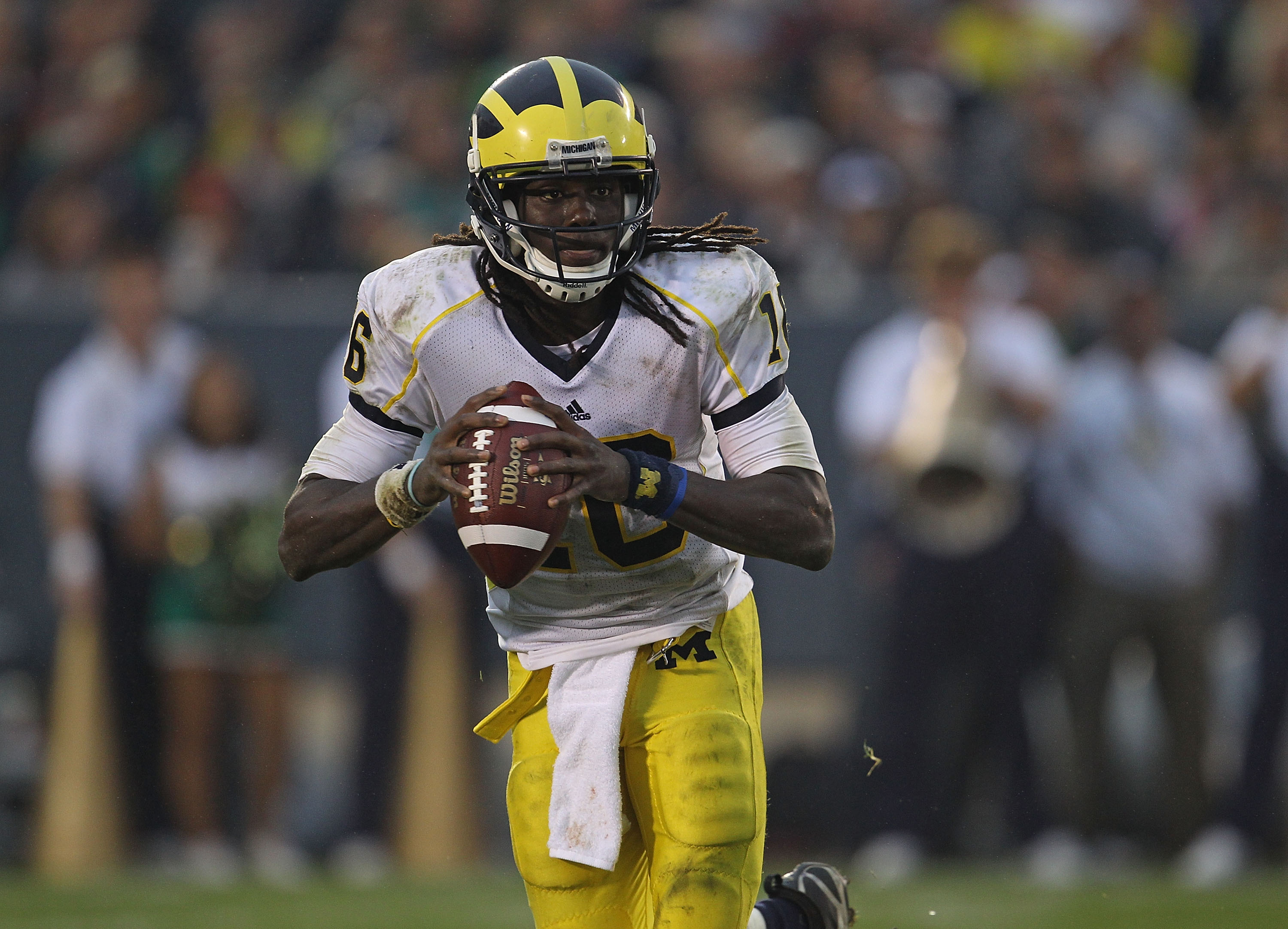 SOUTH BEND, IN - SEPTEMBER 11: Denard Robinson #16 of the Michigan Wolverines looks for a receiver against the Notre Dame Fighting Irish at Notre Dame Stadium on September 11, 2010 in South Bend, Indiana. Michigan defeated Notre Dame 28-24.  (Photo by Jon