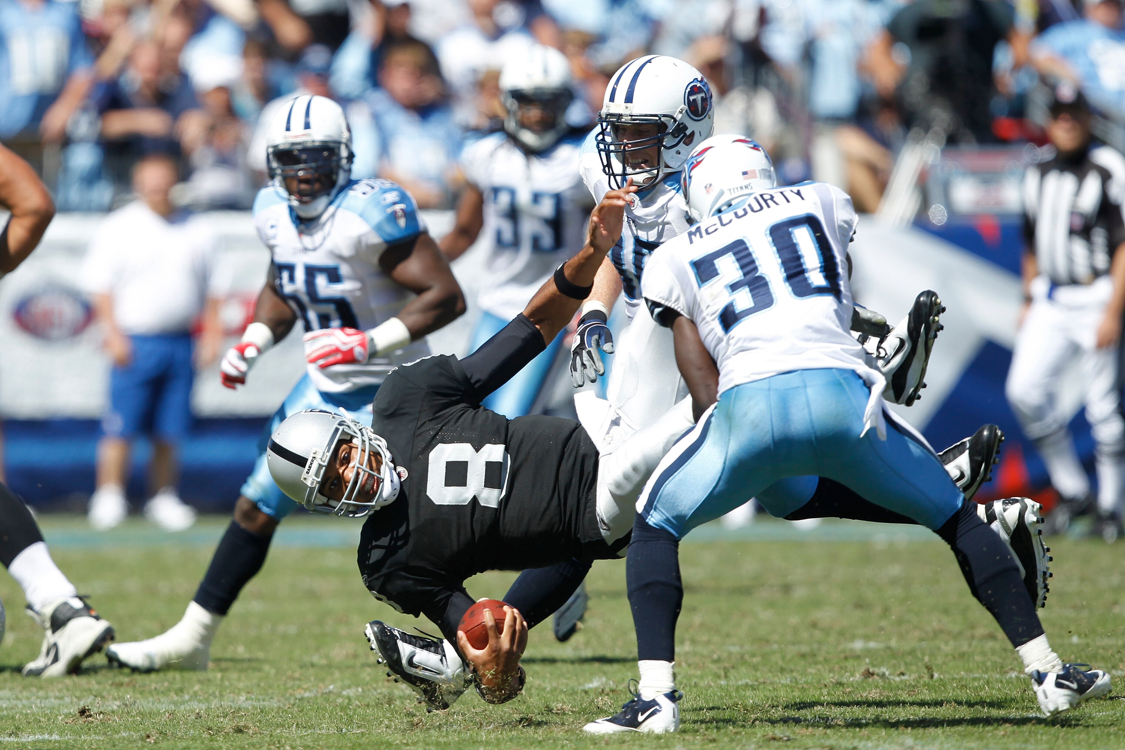 NASHVILLE - SEPTEMBER 12: Jason Campbell #8 of the Oakland Raiders gets tackled by Jason McCourty #30 of the Tennessee Titans during the NFL season opener at LP Field on September 12, 2010 in Nashville, Tennessee. The Titans defeated the Raiders 38-13. (P NASHVILLE - SEPTEMBER 12: Jason Campbell #8 of the Oakland Raiders gets tackled by Jason McCourty #30 of the Tennessee Titans during the NFL season opener at LP Field on September 12, 2010 in Nashville, Tennessee. The Titans defeated the Raiders 38-13. (P