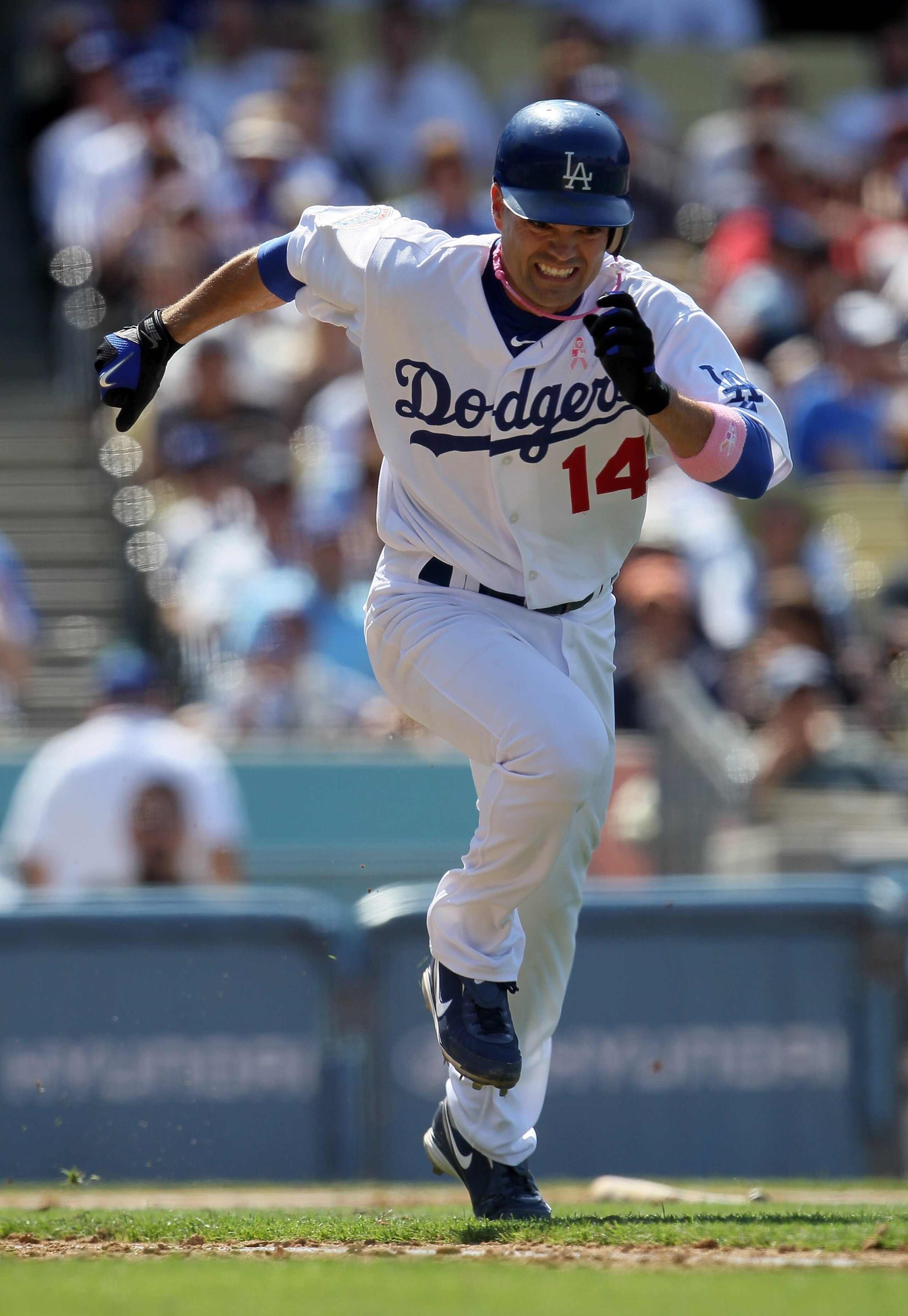 LOS ANGELES, CA - MAY 09:  Jamey Carroll #14 of the Los Angeles Dodgers runs to first base against the Colorado Rockies at Dodger Stadium on May 9, 2010 in Los Angeles, California.  (Photo by Jeff Gross/Getty Images)