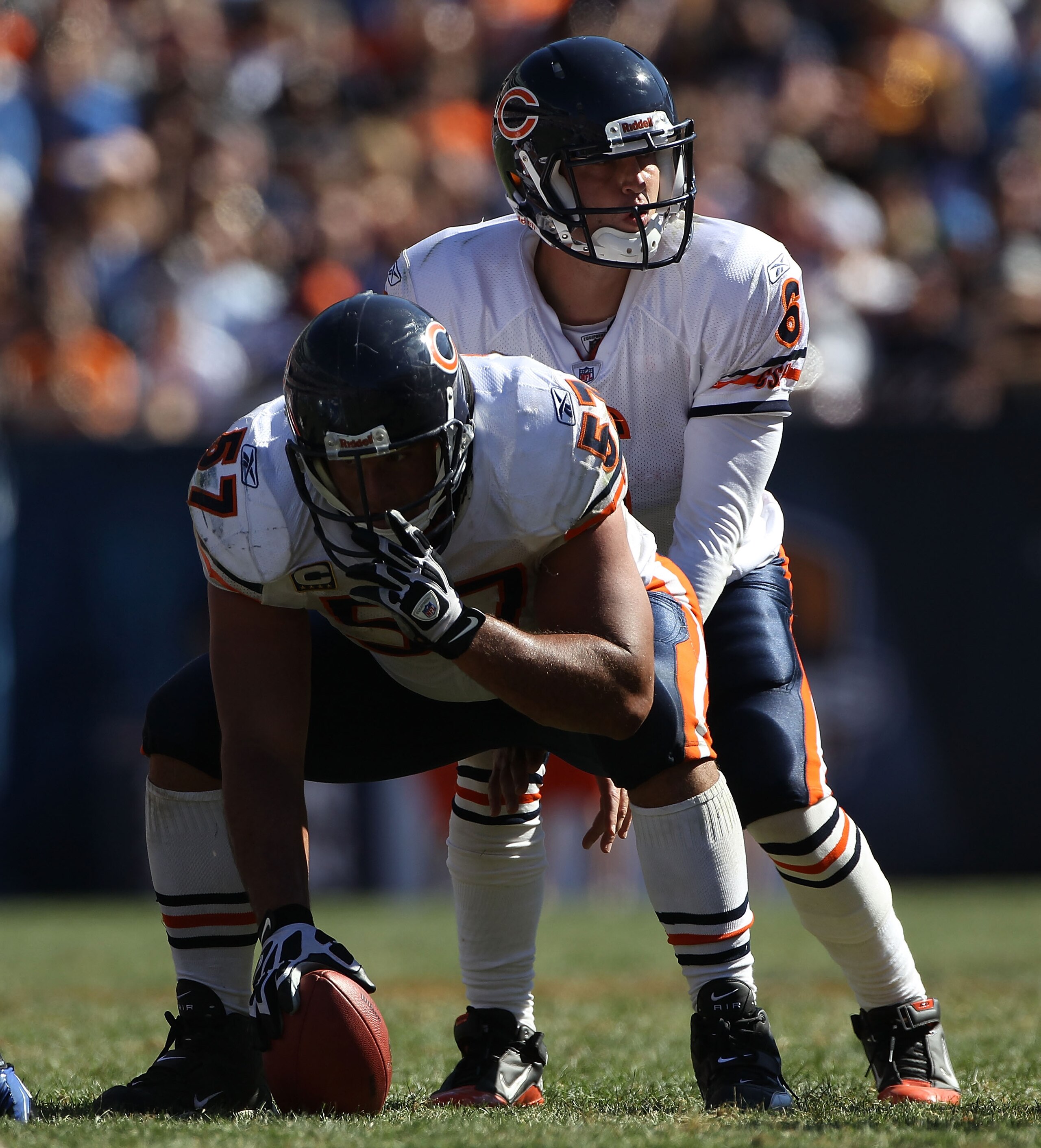CHICAGO - SEPTEMBER 12: Jay Cutler #6 of the Chicago Bears calls play signals as teammate Olin Kreutz #57 prepares to snap the ball against the Detroit Lions during the NFL season opening game at Soldier Field on September 12, 2010 in Chicago, Illinois. T