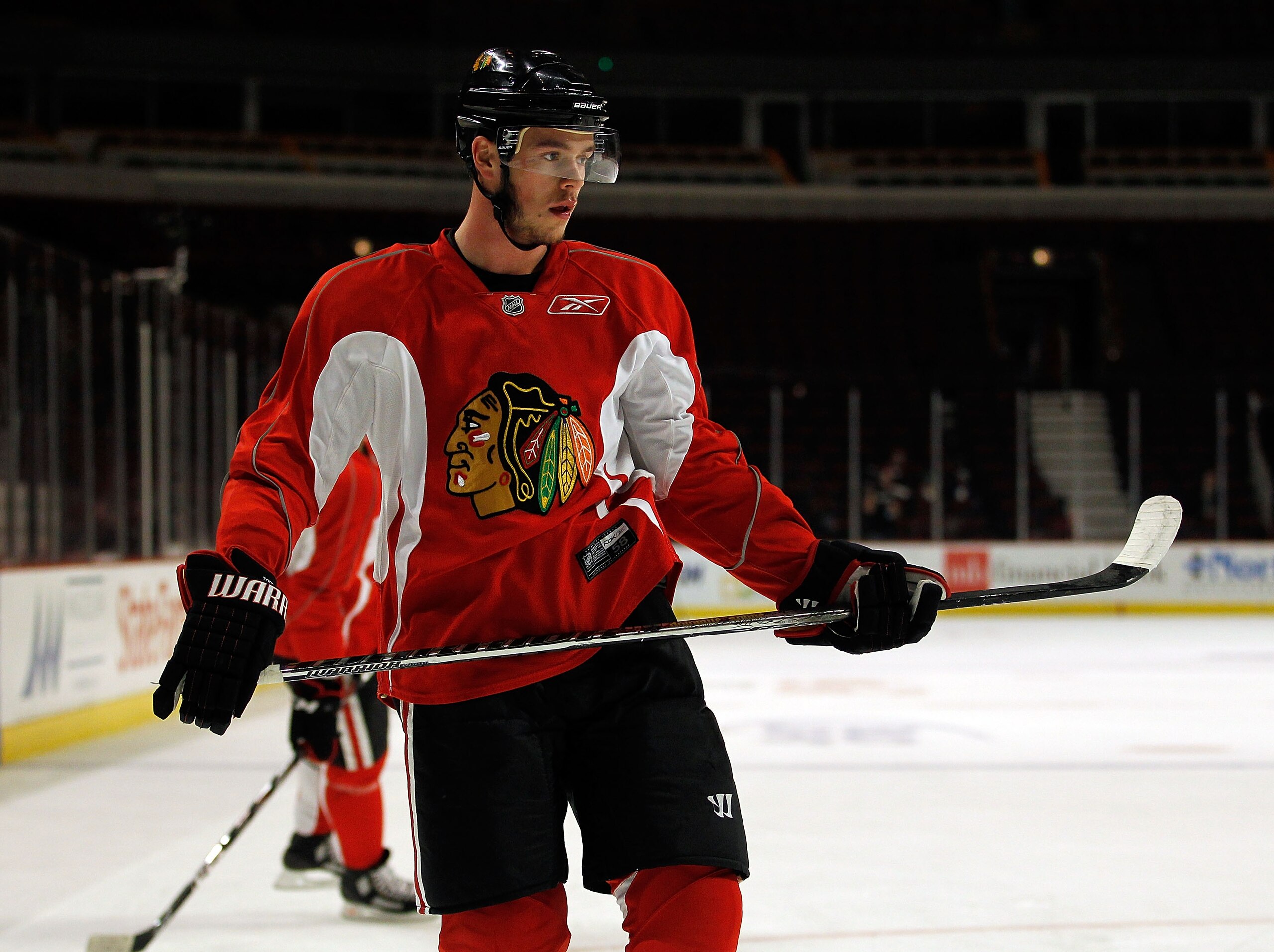CHICAGO - MAY 28: Jonathan Toews #19 of the Chicago Blackhawks watches as teammates shoot the puck during Stanley Cup practice at the United Center on May 28, 2010 in Chicago, Illinois. (Photo by Jonathan Daniel/Getty Images)