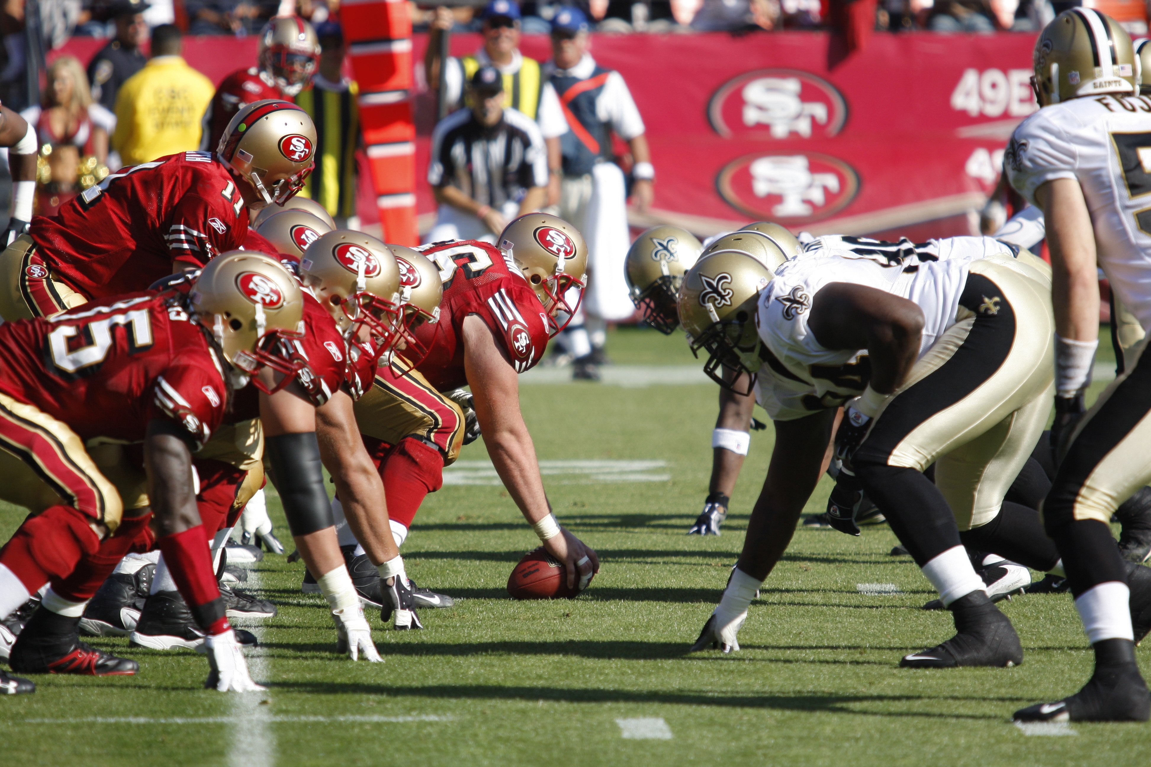SAN FRANCISCO - October 28:  Center Justin Heitmann #66 and quarterback Alex Smith #11 of the San Francisco 49ers get ready to hike the ball during the game against the New Orleans Saints on October 28, 2007 at Monster Park in San Francisco, California.