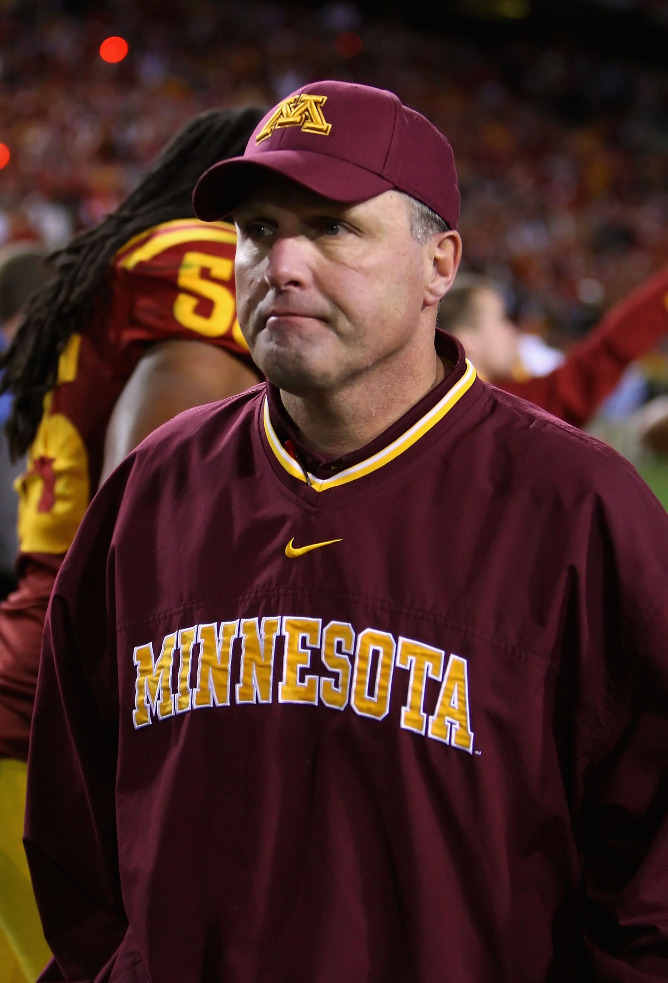TEMPE, AZ - DECEMBER 31:  Head coach Tim Brewster of the Minnesota Golden Gophers walks off the field after being defeated by the Iowa State Cyclones in the Insight Bowl at Arizona Stadium on December 31, 2009 in Tempe, Arizona. The Cyclones defeated the 