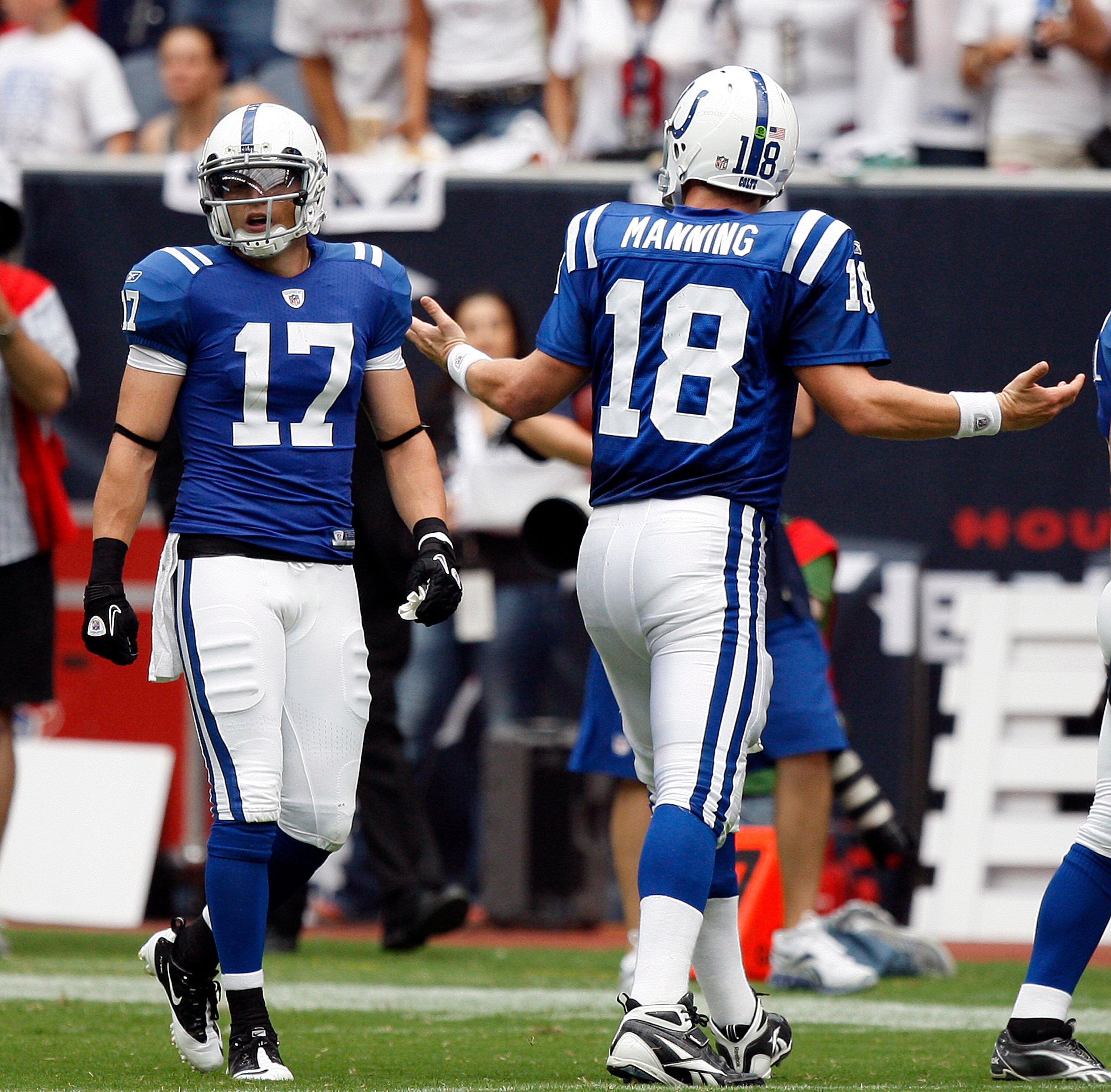 HOUSTON - SEPTEMBER 12:  Quarterback Peyton Manning #18 of the Indianapolis Colts gestures to wide receiver Austion Collie #17 after a change of possession against the Houston Texans during the NFL season opener at Reliant Stadium on September 12, 2010 in