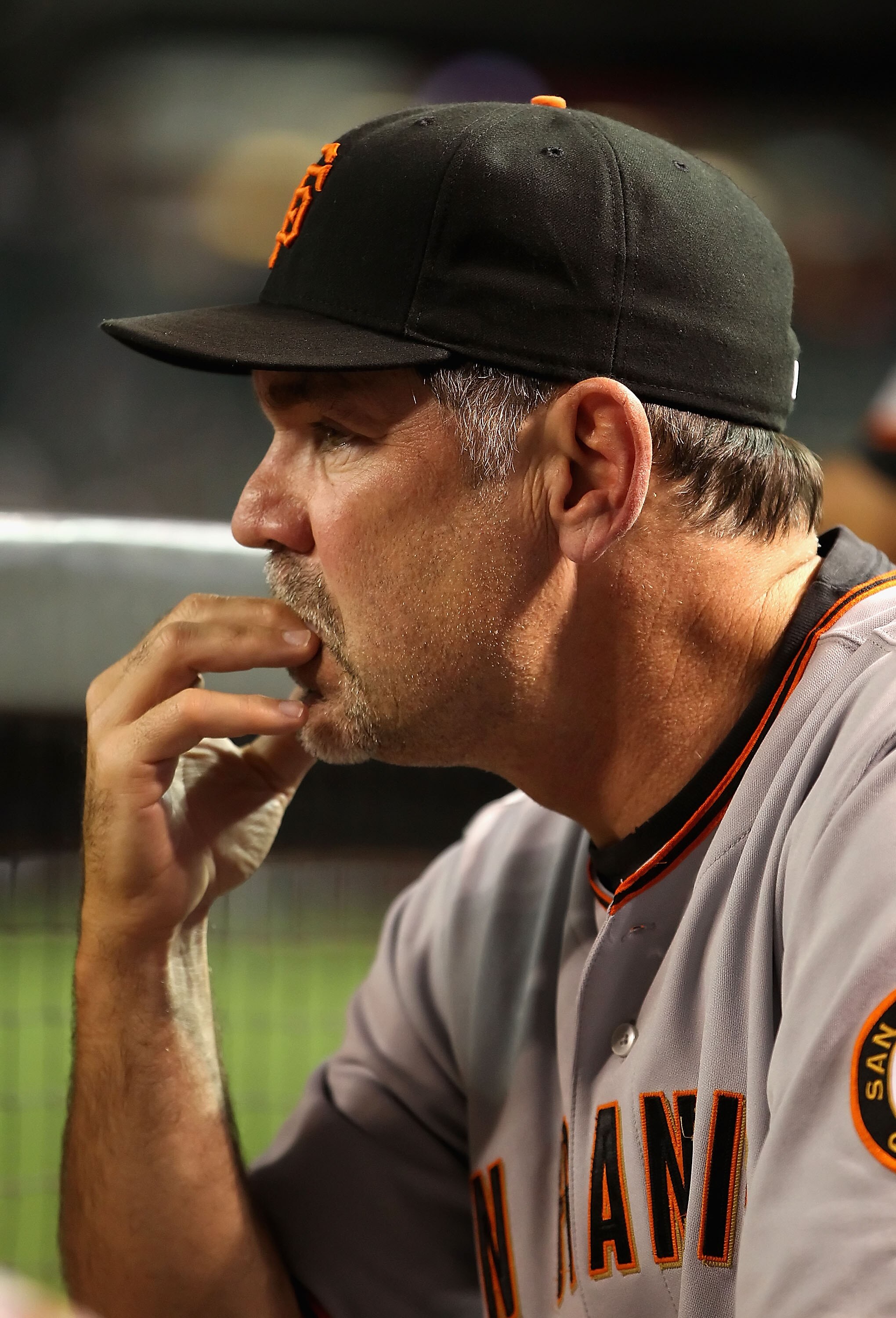 PHOENIX - MAY 19:  Manager Bruce Bochy of the San Francisco Giants watches from the dugout during the Major League Baseball game against the Arizona Diamondbacks at Chase Field on May 19, 2010 in Phoenix, Arizona.  (Photo by Christian Petersen/Getty Image