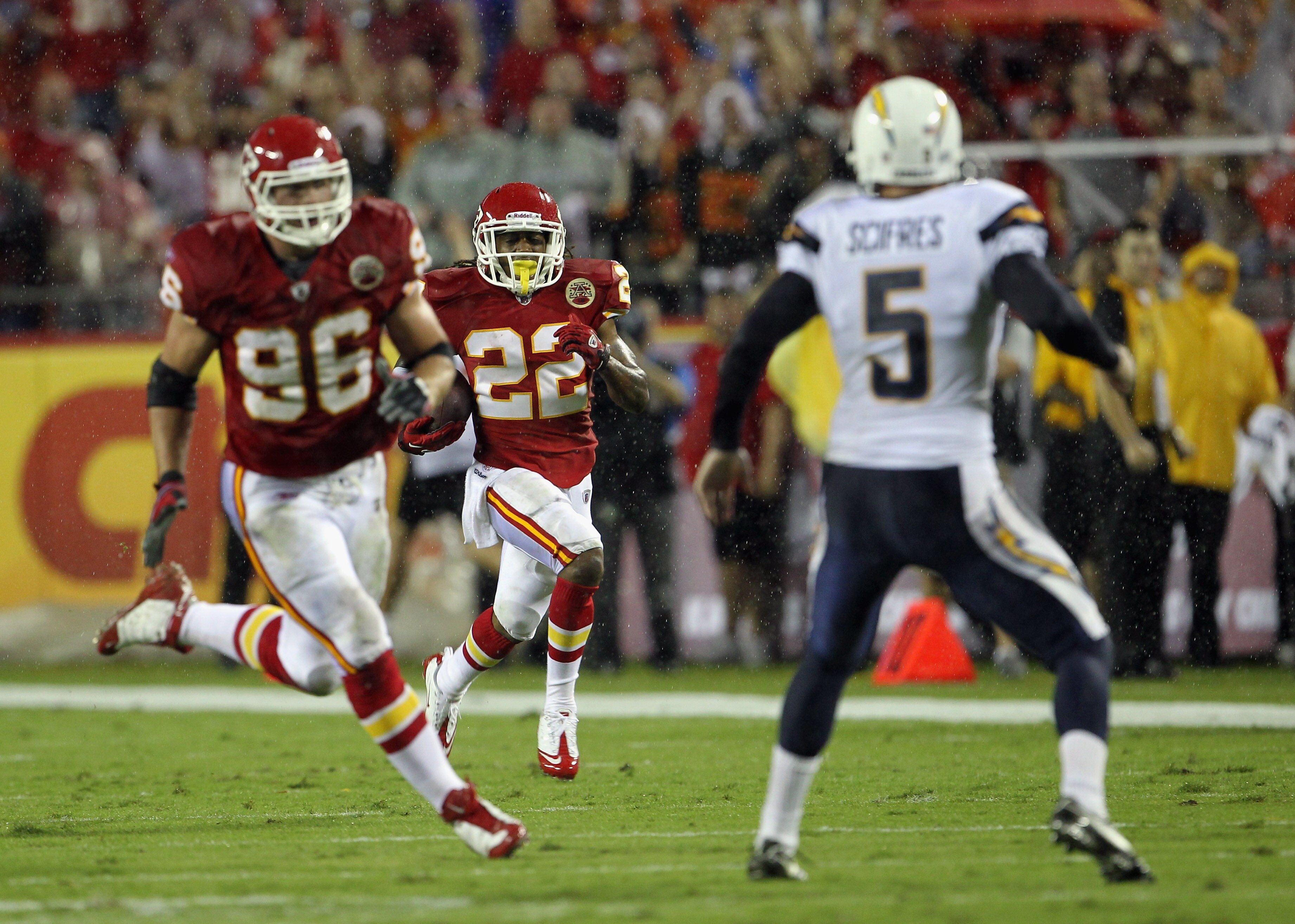 KANSAS CITY, MO - SEPTEMBER 13:  Dexter McCluster #22 of the Kansas City Chiefs returns a punt for a touchdown as punter Mike Scifres #5 of the San Diego Chargers defends during the 1st half of the game against on September 13, 2010 at Arrowhead Stadium i