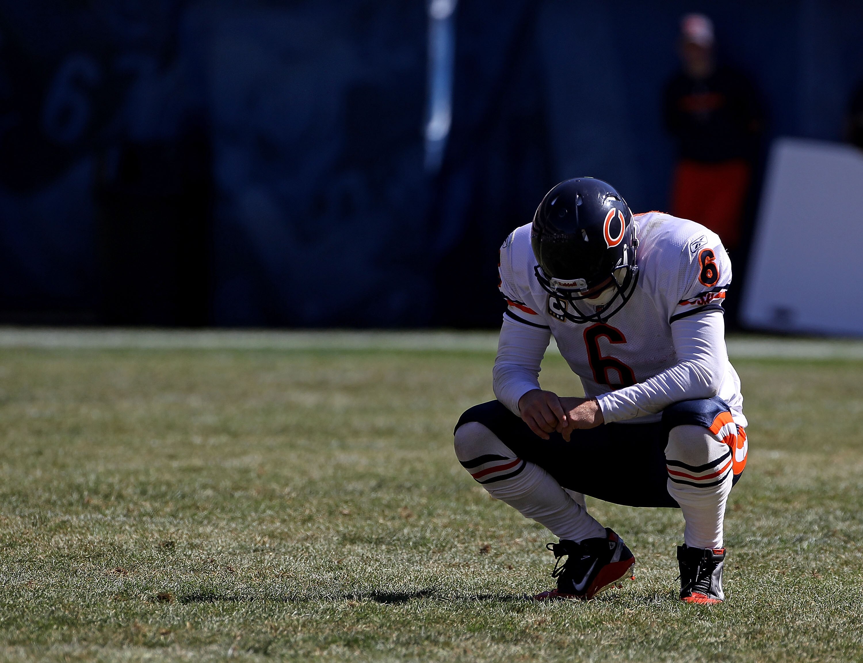 CHICAGO - SEPTEMBER 12: Jay Cutler #6 of the Chicago Bears rests during a time-out against the Detroit Lions during the NFL season opening game at Soldier Field on September 12, 2010 in Chicago, Illinois. The Bears defeated the Lions 19-14. (Photo by Jona