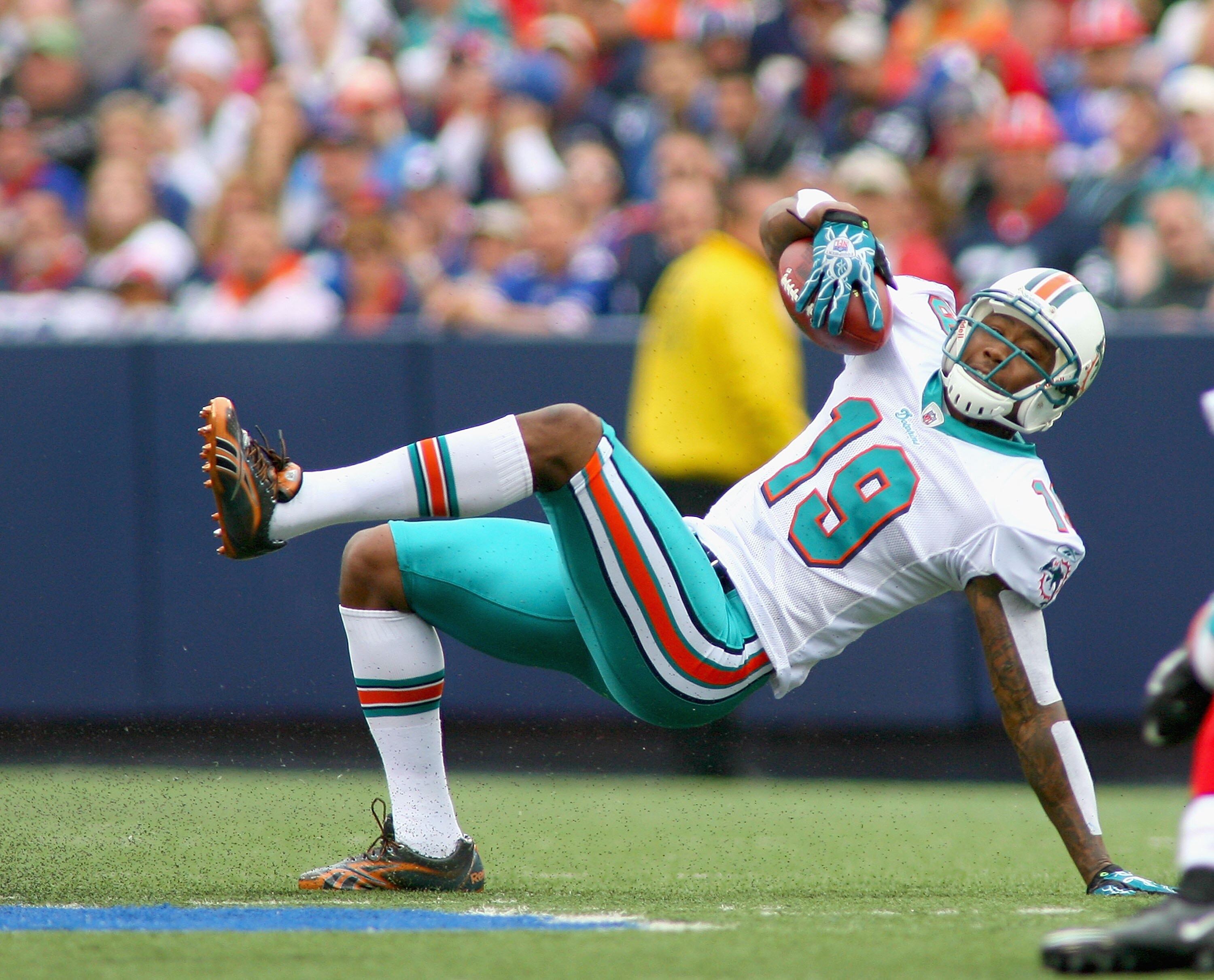 ORCHARD PARK, NY - SEPTEMBER 12:  Brandon Marshall #19 of the Miami Dolphins keeps his footing against the Buffalo Bills during the NFL season opener at Ralph Wilson Stadium on September 12, 2010 in Orchard Park, New York.  (Photo by Rick Stewart/Getty Im