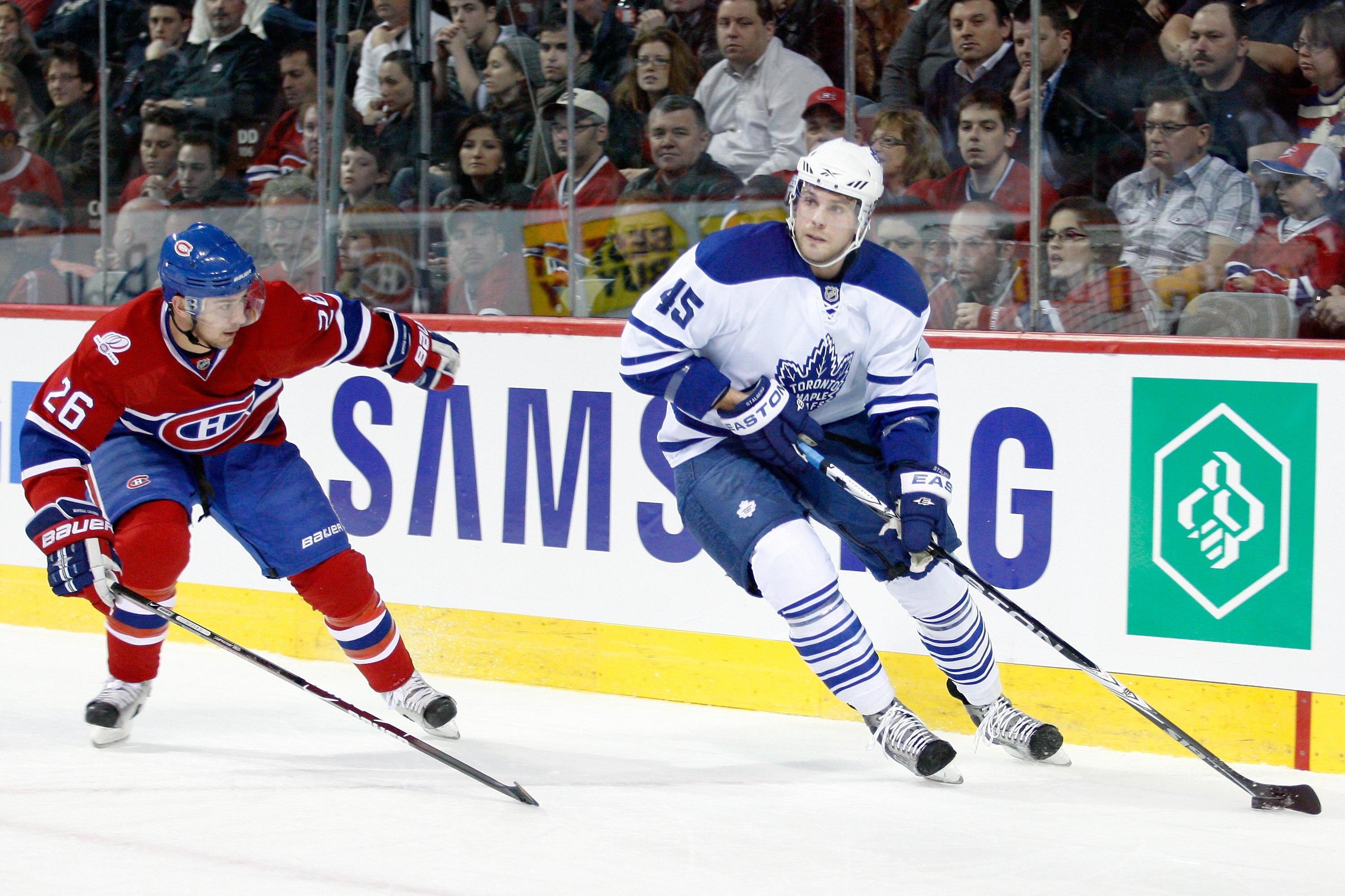 MONTREAL- APRIL 10:  Viktor Stalberg #45 of the Toronto Maple Leafs skates with the puck while being defended by Josh Gorges #26 of the Montreal Canadiens during the NHL game on April 10, 2010 at the Bell Centre in Montreal, Quebec, Canada.  The Maple Lea
