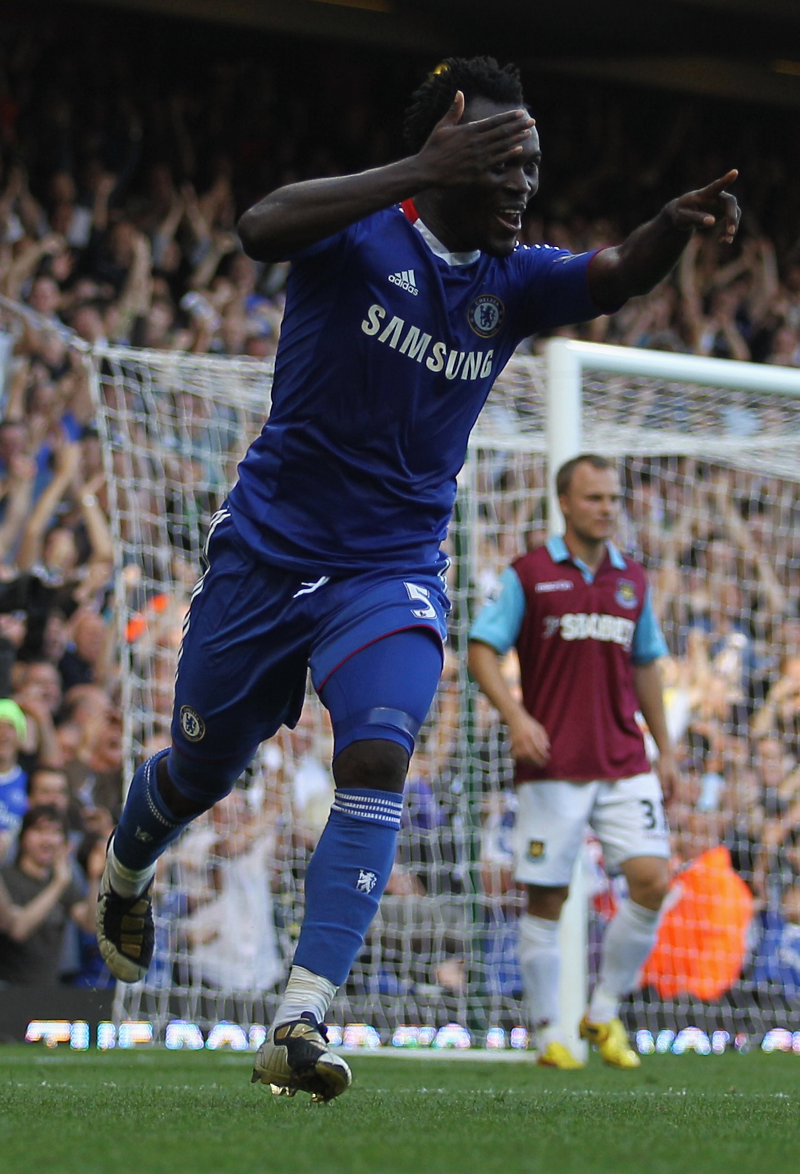 LONDON, ENGLAND - SEPTEMBER 11:  Michael Essien of Chelsea celebrates as he scores their third goal with a header during the Barclays Premier League match between West Ham United and Chelsea at the Boleyn Ground on September 11, 2010 in London, England.