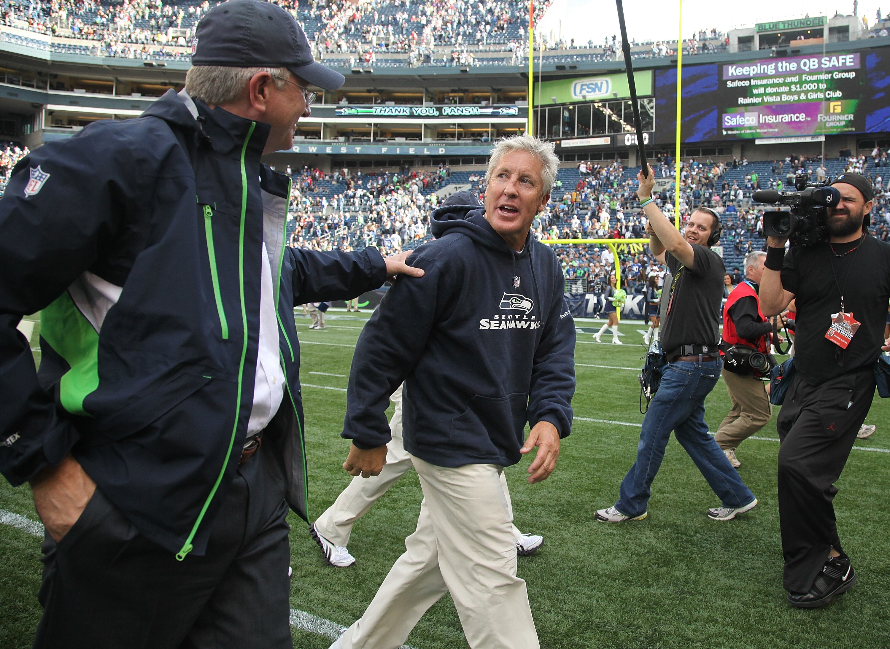 SEATTLE - SEPTEMBER 12:  Head coach Pete Carroll of the Seattle Seahawks (R) is congratulated by Seahawks' Chief Executive Officer  Tod Leiweke after the NFL season opener against the San Francisco 49ers at Qwest Field on September 12, 2010 in Seattle, Wa