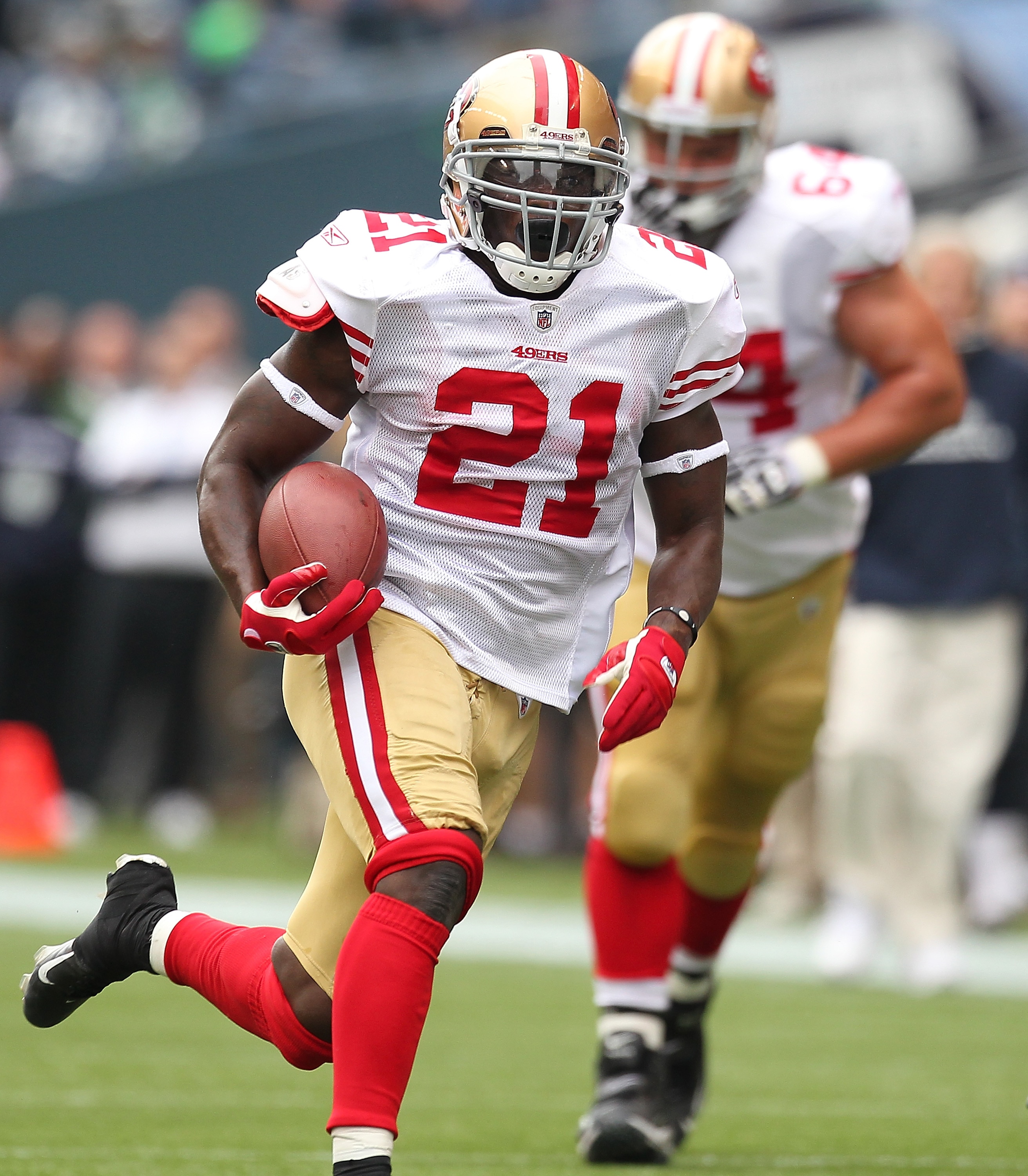 SEATTLE - SEPTEMBER 12:  Running back Frank Gore #21 of the San Francisco 49ers rushes during the NFL season opener against the Seattle Seahawks at Qwest Field on September 12, 2010 in Seattle, Washington. The Seahawks defeated the 49ers 31-6. (Photo by O