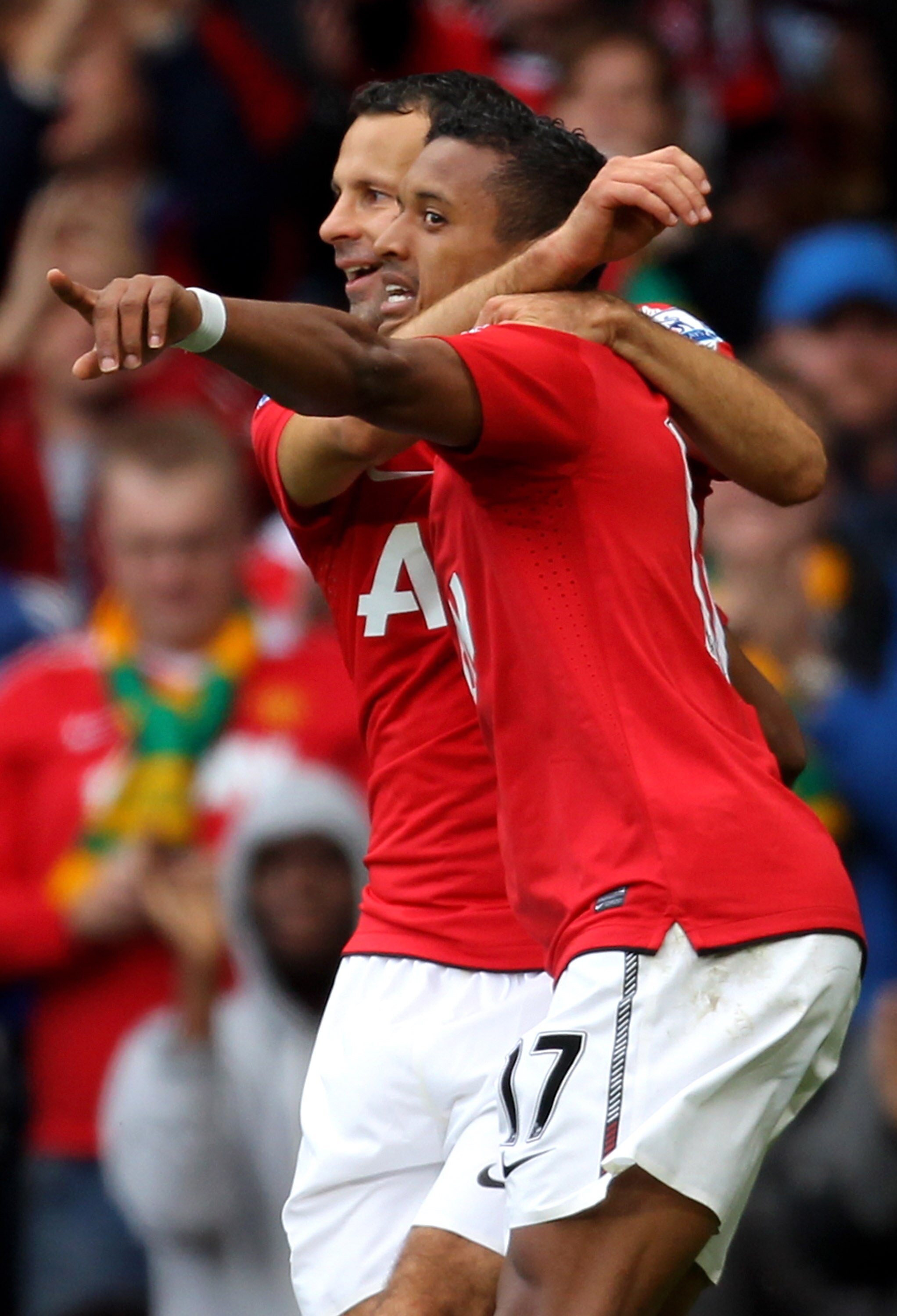 MANCHESTER, ENGLAND - AUGUST 28:  Nani of Manchester United is congratulated by team mate Ryan Giggs (L) after scoring his team's second goal during the Barclays Premier League match between Manchester United and West Ham United at Old Trafford on August