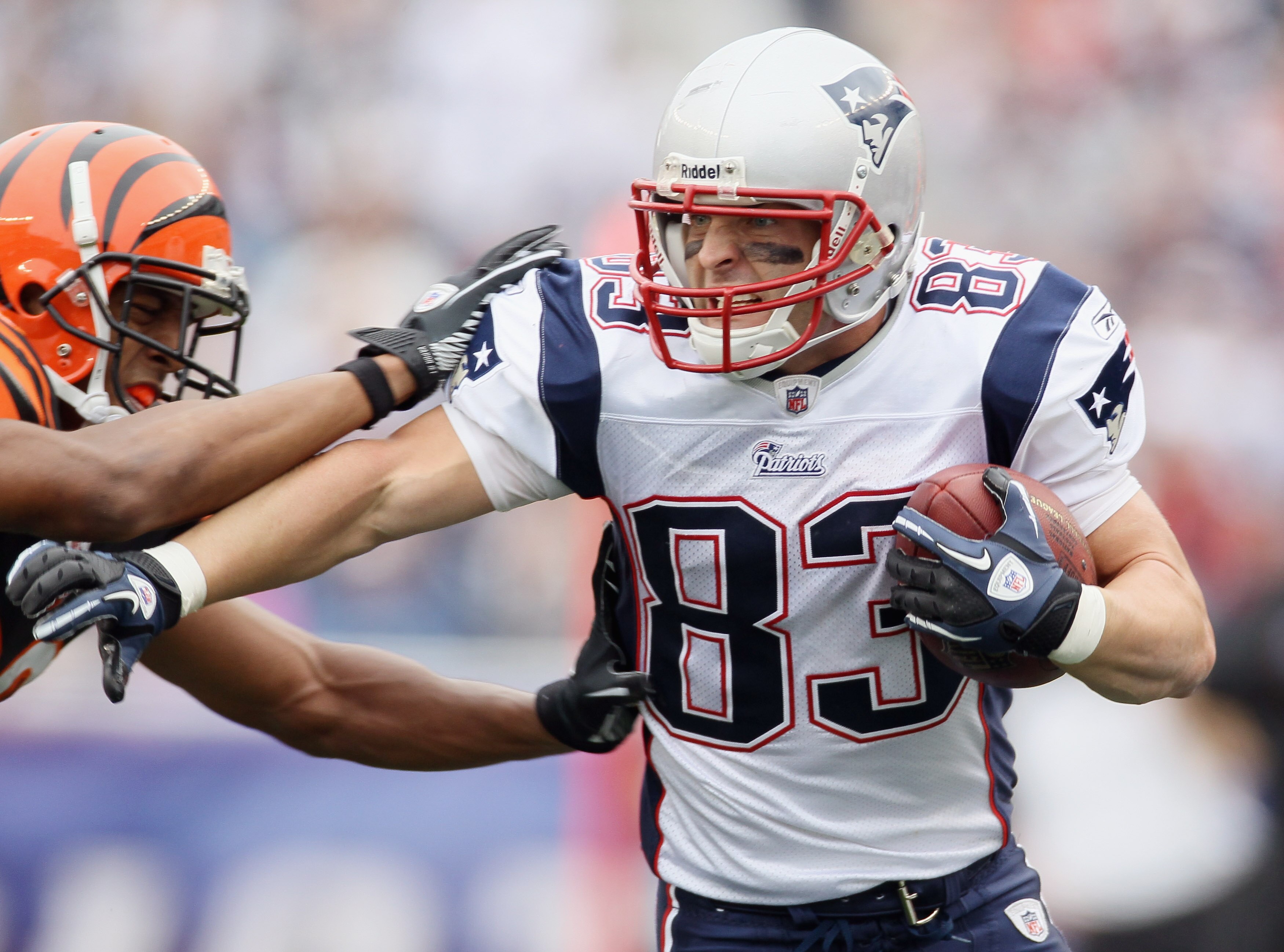 FOXBORO, MA - SEPTEMBER 12:  Wes Welker #83 of the New England Patriots carries the ball as Leon Hall #29 of the Cincinnati Bengals defends during the NFL season opener on September 12, 2010 at Gillette Stadium in Foxboro, Massachusetts. The Patriots defe