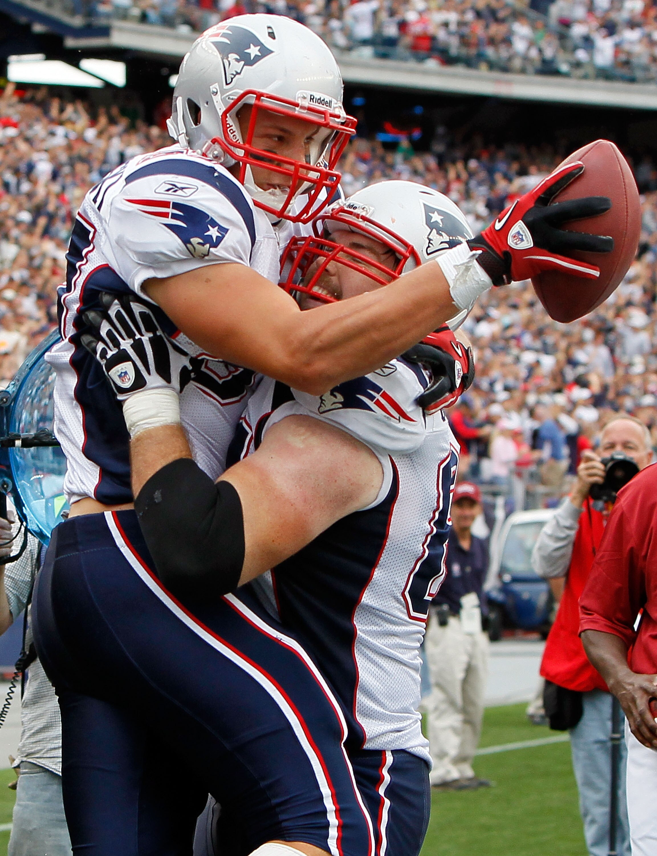 FOXBORO, MA - SEPTEMBER 12:  Rob Gronkowski #87 of the New England Patriots celebrates his touchdown catch with teammate Dan Connolly #63 in the second half against the Cincinnati Bengals during during the NFL season opener at Gillette Stadium on Septembe