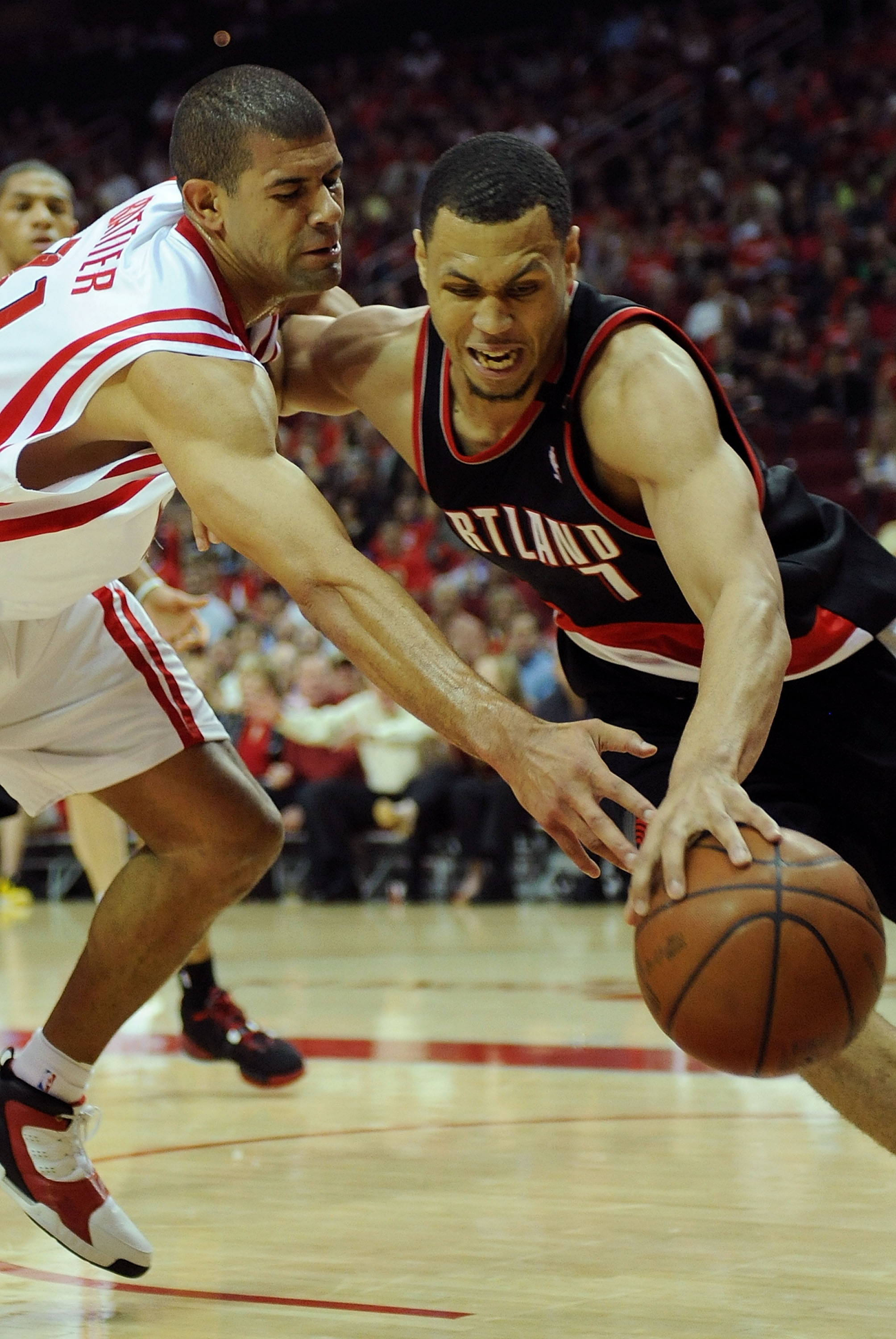 HOUSTON - APRIL 24:  Guard Brandon Roy #7 of the Portland Trail Blazers dribbles the ball past Shane Battier #31 of the Houston Rockets in Game Three of the Western Conference Quarterfinals during the 2009 NBA Playoffs at Toyota Center on April 24, 2009 i