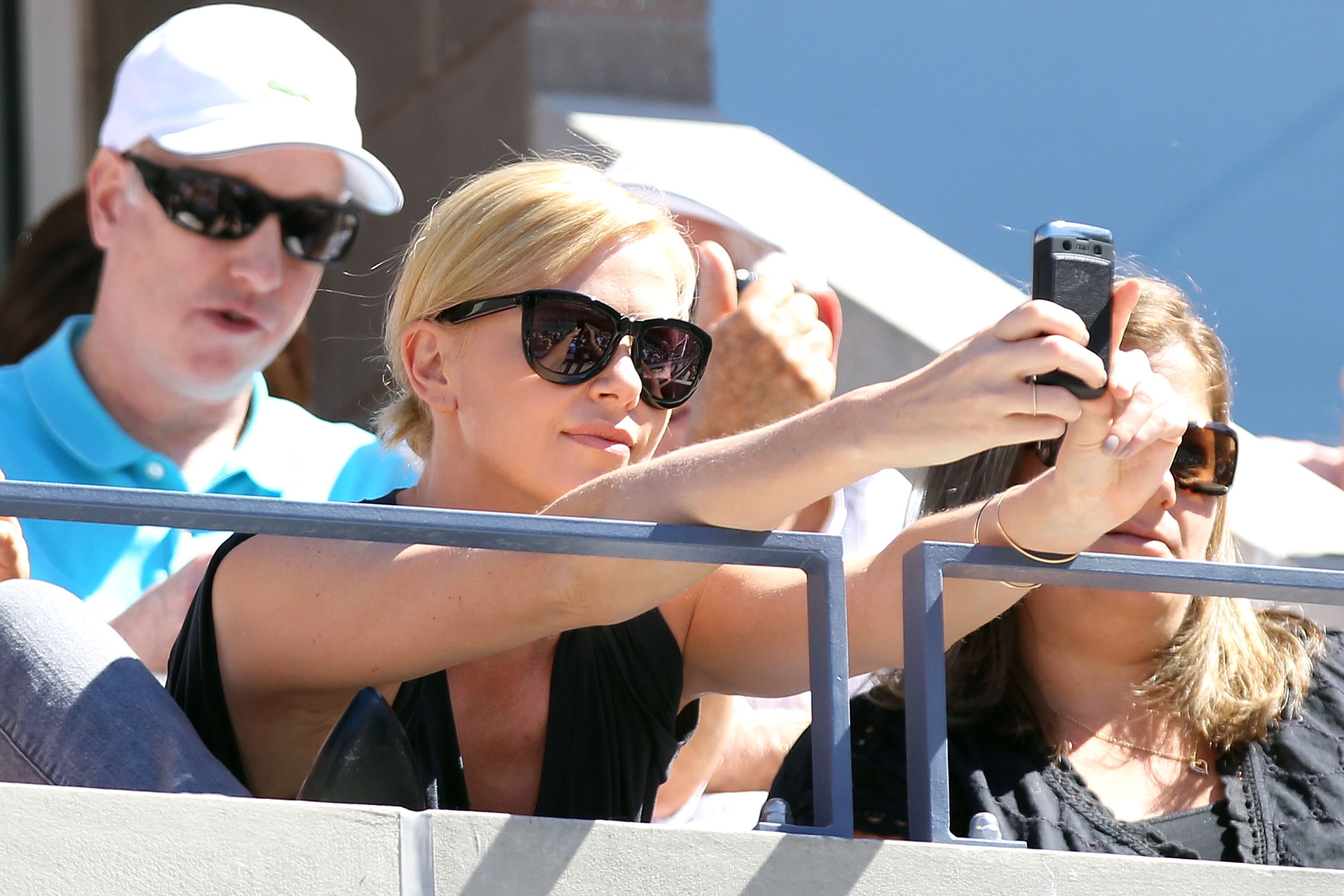 NEW YORK - SEPTEMBER 11:  Actress Charlize Theron attends the men's singles semifinal match between Rafael Nadal of Spain and Mikhail Youzhny of Russia during day thirteen of the 2010 U.S. Open at the USTA Billie Jean King National Tennis Center on Septem