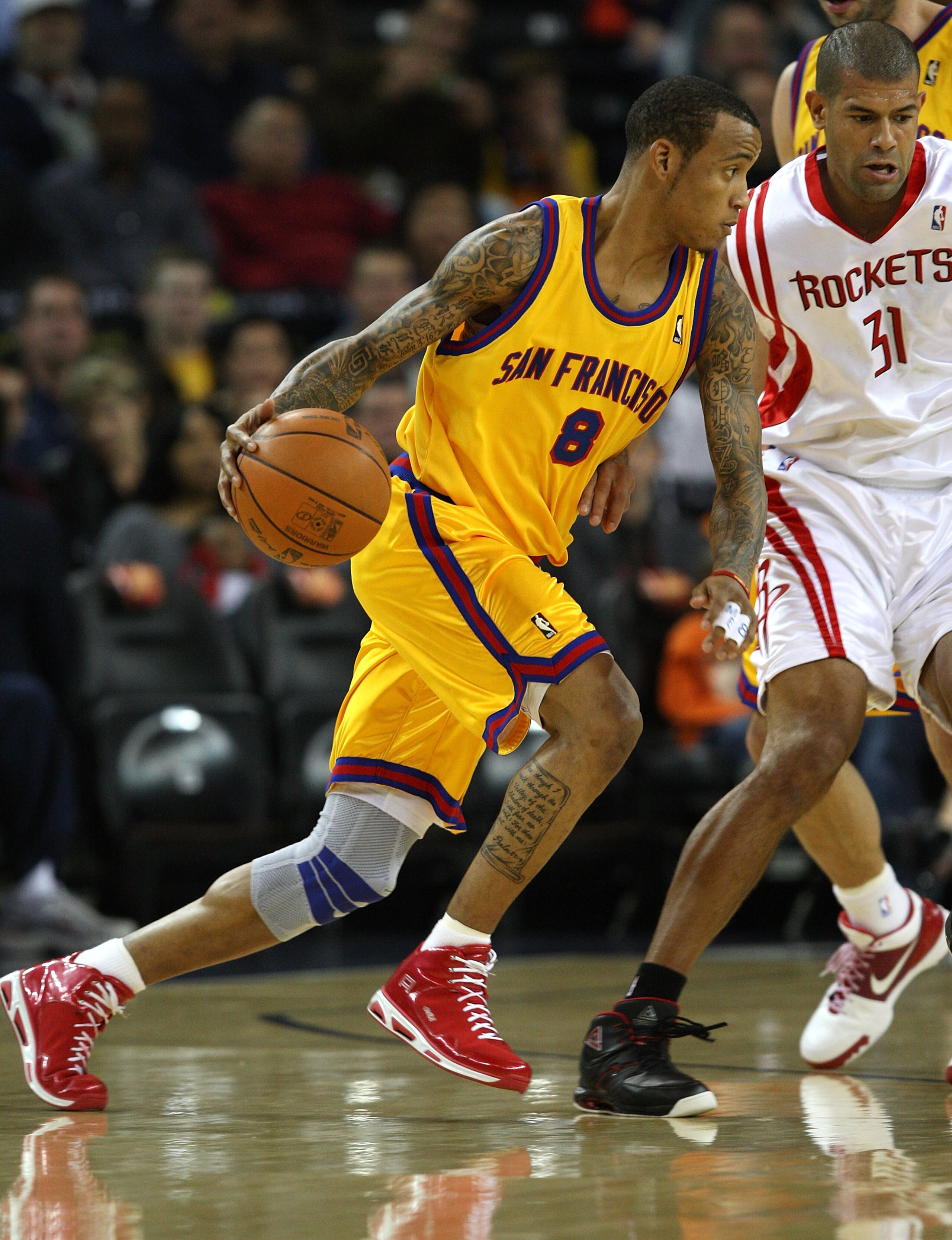 OAKLAND, CA - DECEMBER 03: Monta Ellis #8 of the Golden State Warriors drives against Shane Battier #31 of the Houston Rockets during an NBA game at Oracle Arena on December 3, 2009 in Oakland, California. NOTE TO USER: User expressly acknowledges and ag OAKLAND, CA - DECEMBER 03: Monta Ellis #8 of the Golden State Warriors drives against Shane Battier #31 of the Houston Rockets during an NBA game at Oracle Arena on December 3, 2009 in Oakland, California. NOTE TO USER: User expressly acknowledges and ag