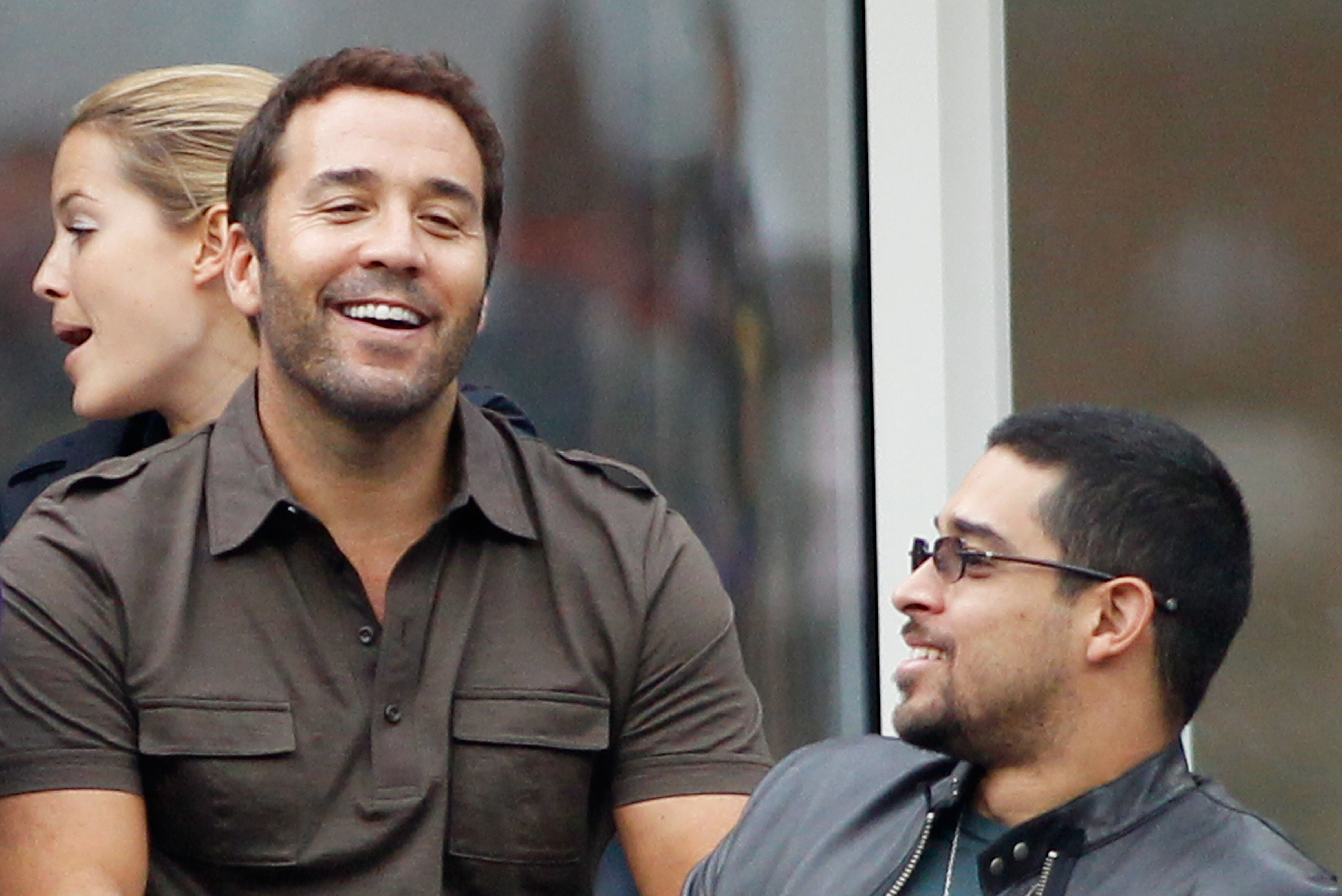 NEW YORK - SEPTEMBER 13:  Jeremy Piven and Wilmer Valderrama watch the men's singles final match between Novak Djokovic of Serbia and Rafael Nadal of Spain during day fifteen of the 2010 U.S. Open at the USTA Billie Jean King National Tennis Center on Sep