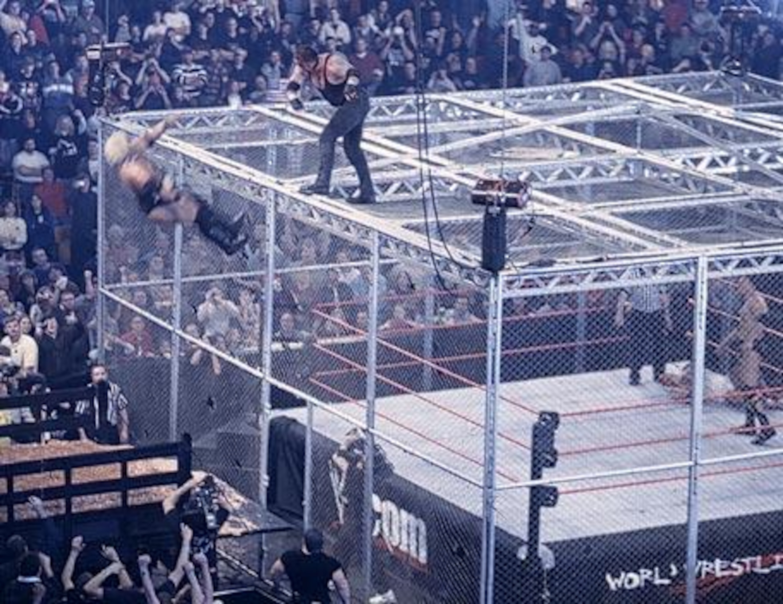 In a repeat of KOTR 98, The Undertaker threw Rikishi from the top of the Cell