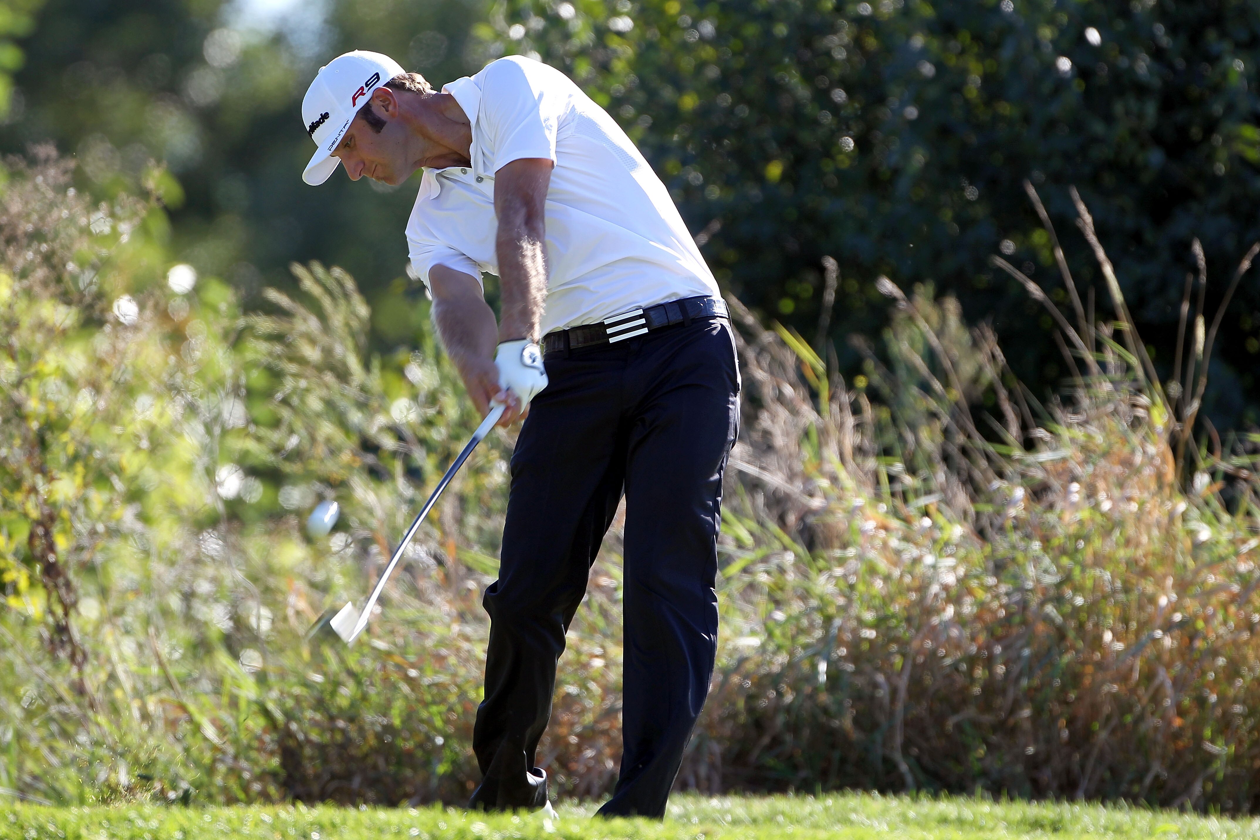 LEMONT, IL - SEPTEMBER 12:  Dustin Johnson tees off on the 16th hole during the final round of the BMW Championship at Cog Hill Golf & Country Club on September 12, 2010 in Lemont, Illinois.  (Photo by Jamie Squire/Getty Images)