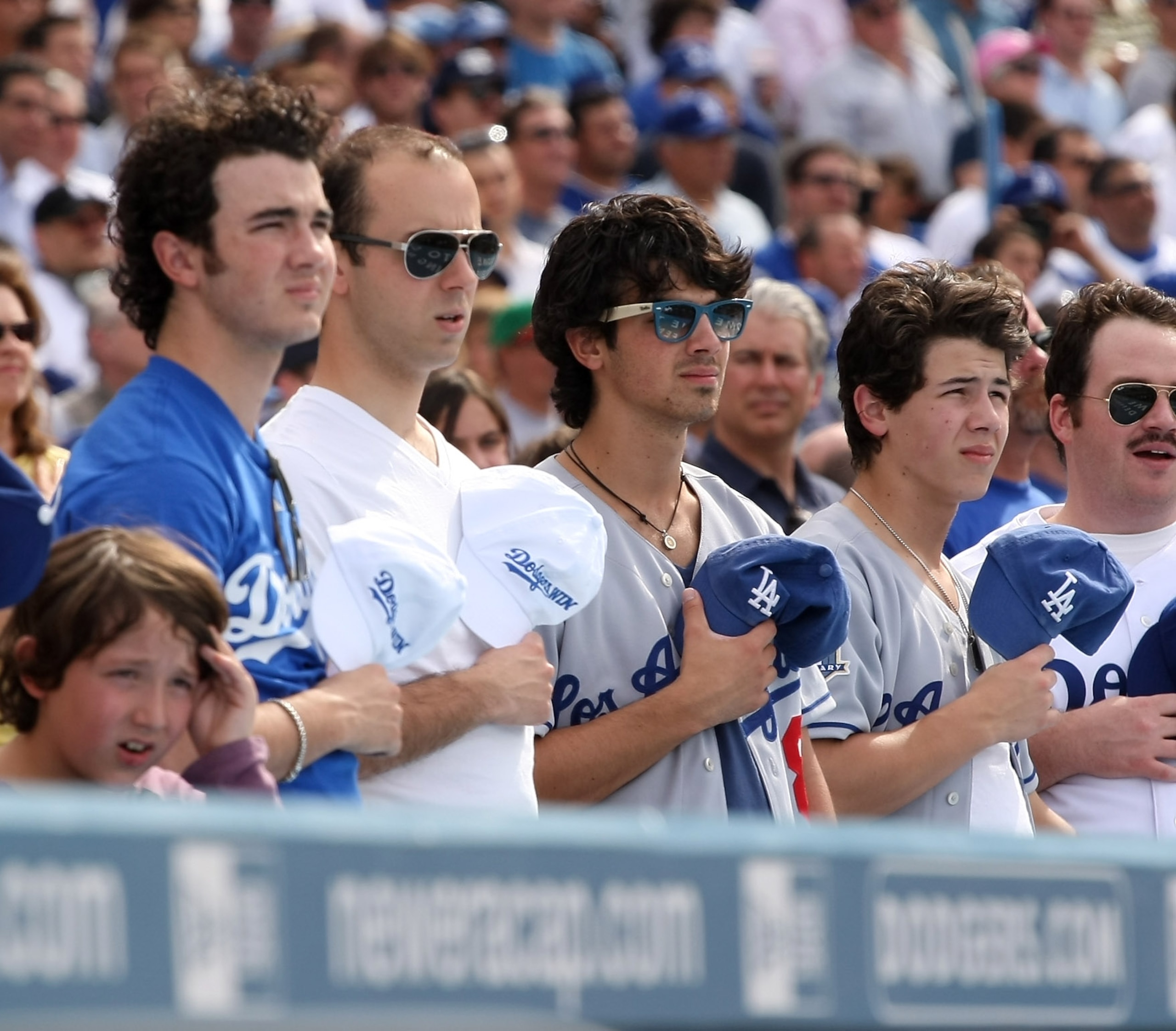 LOS ANGELES, CA - APRIL 13: Kevin Jonas (L), Joe Jonas second from R) and Nick Jonas (R) of the Jonas Brothers stand during the singing of God Bless Americas during the seventh inning stretch of the game between the Los Angeles Dodgers and the San Franci LOS ANGELES, CA - APRIL 13: Kevin Jonas (L), Joe Jonas second from R) and Nick Jonas (R) of the Jonas Brothers stand during the singing of God Bless Americas during the seventh inning stretch of the game between the Los Angeles Dodgers and the San Franci