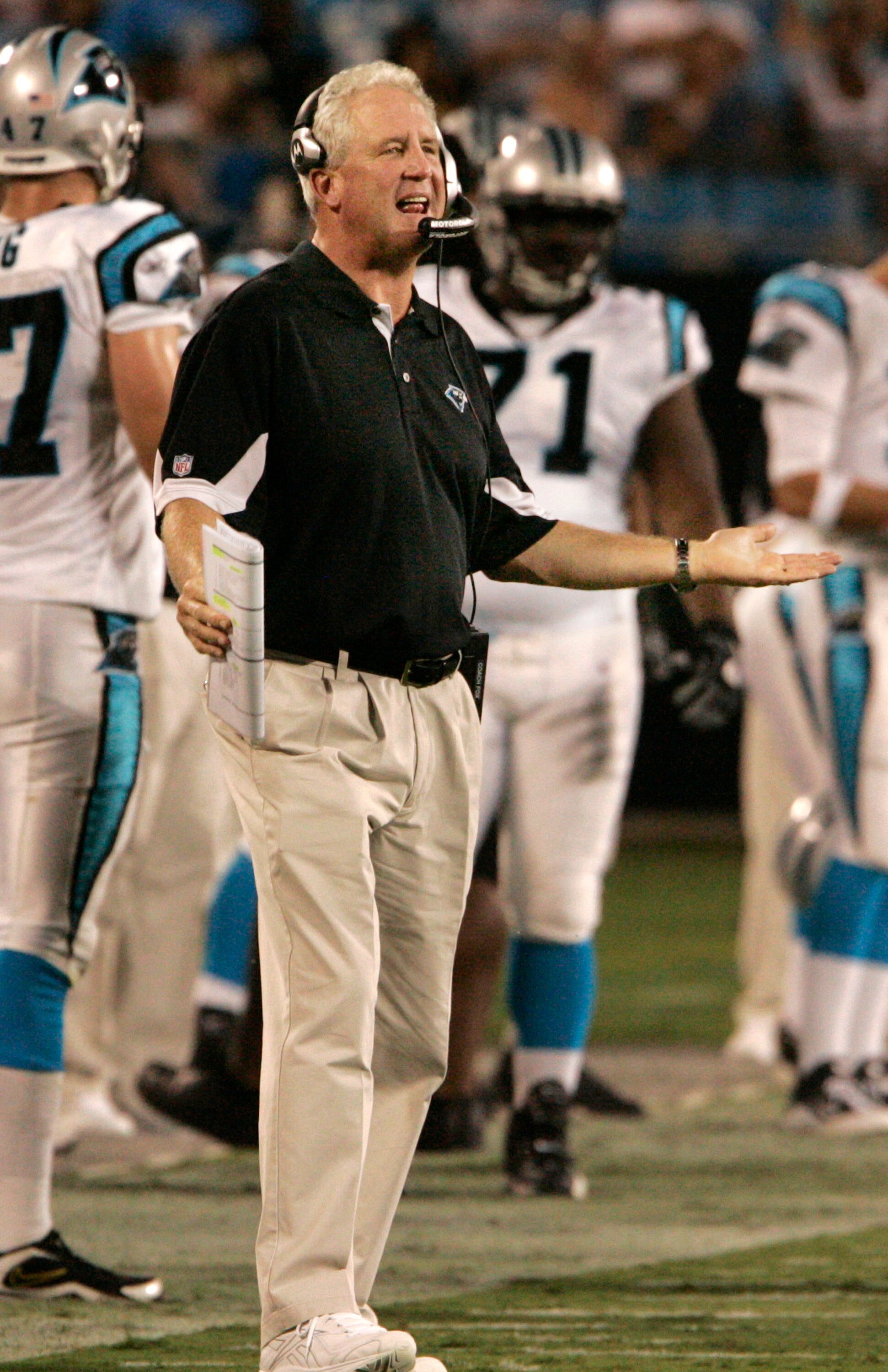 CHARLOTTE, NC - AUGUST 21:  John Fox of the Carolina Panthers throws out his arms  to the officials during their preseason game against the New York Jets at Bank of America Stadium on August 21, 2010 in Charlotte, North Carolina. (Photo by Mary Ann Chasta