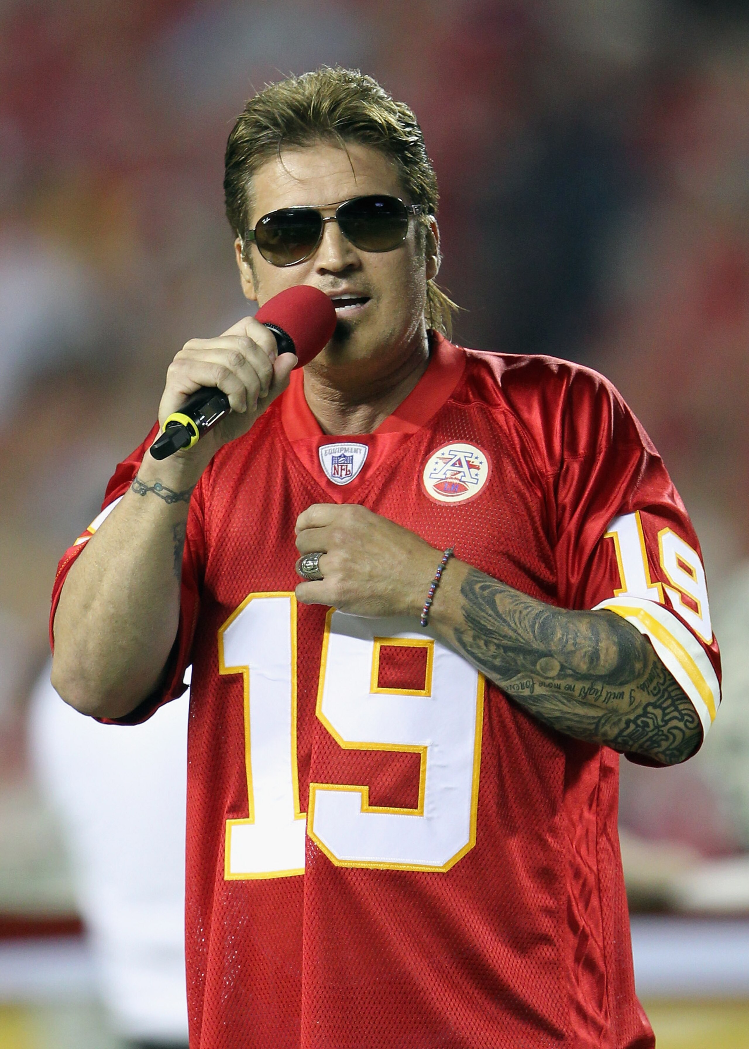 KANSAS CITY, MO - SEPTEMBER 13:  Singer Billy Ray Cyrus sings the National Anthem prior to the start of the game between the San Diego Chargers and the Kansas City Chiefs on September 13, 2010 at Arrowhead Stadium in Kansas City, Missouri.  (Photo by Jami