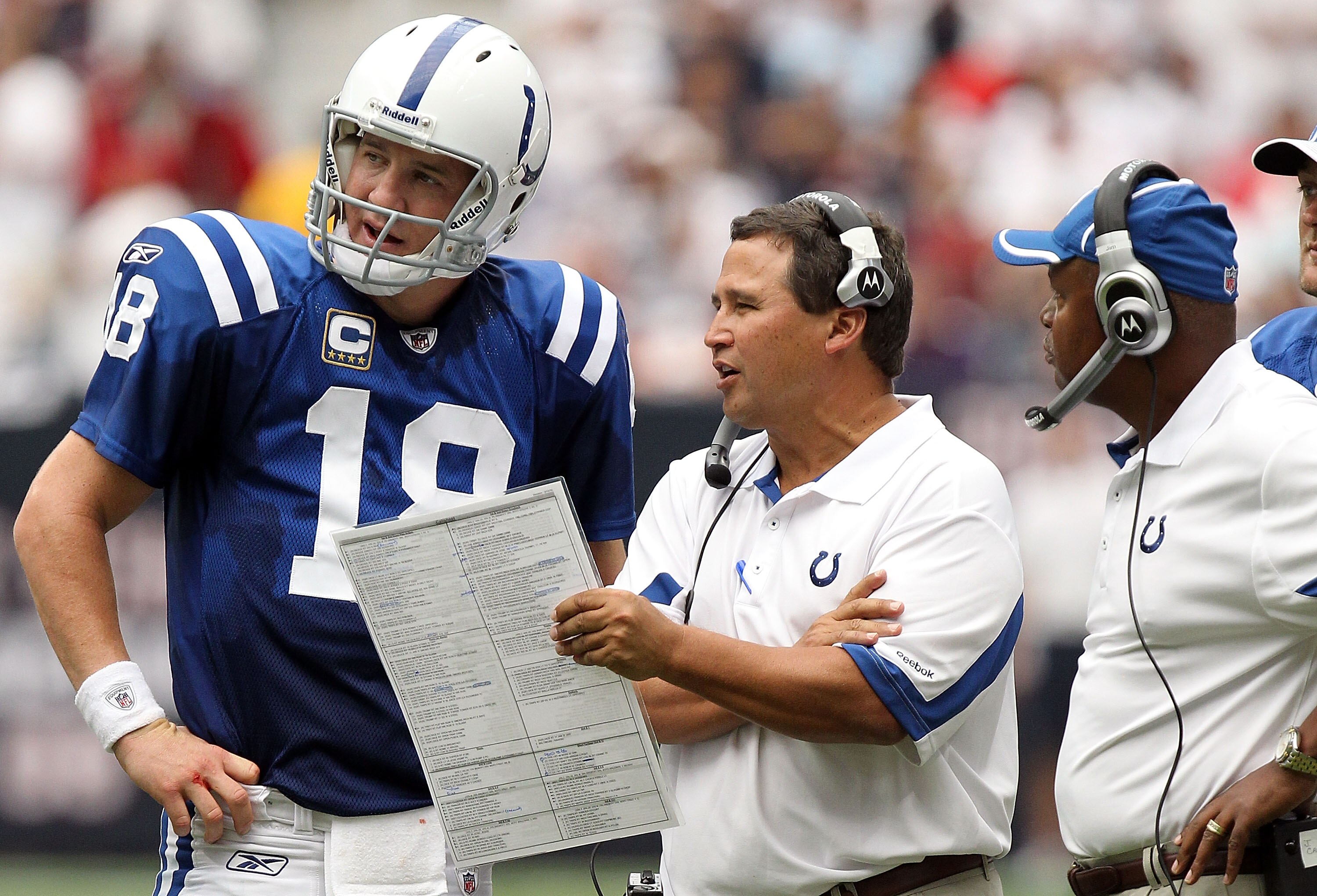 HOUSTON - SEPTEMBER 12:  Offensive coordinator Clyde Christensen talks with Peyton Manning #18 of the Indianapolis Colts at Reliant Stadium on September 12, 2010 in Houston, Texas.  (Photo by Ronald Martinez/Getty Images)