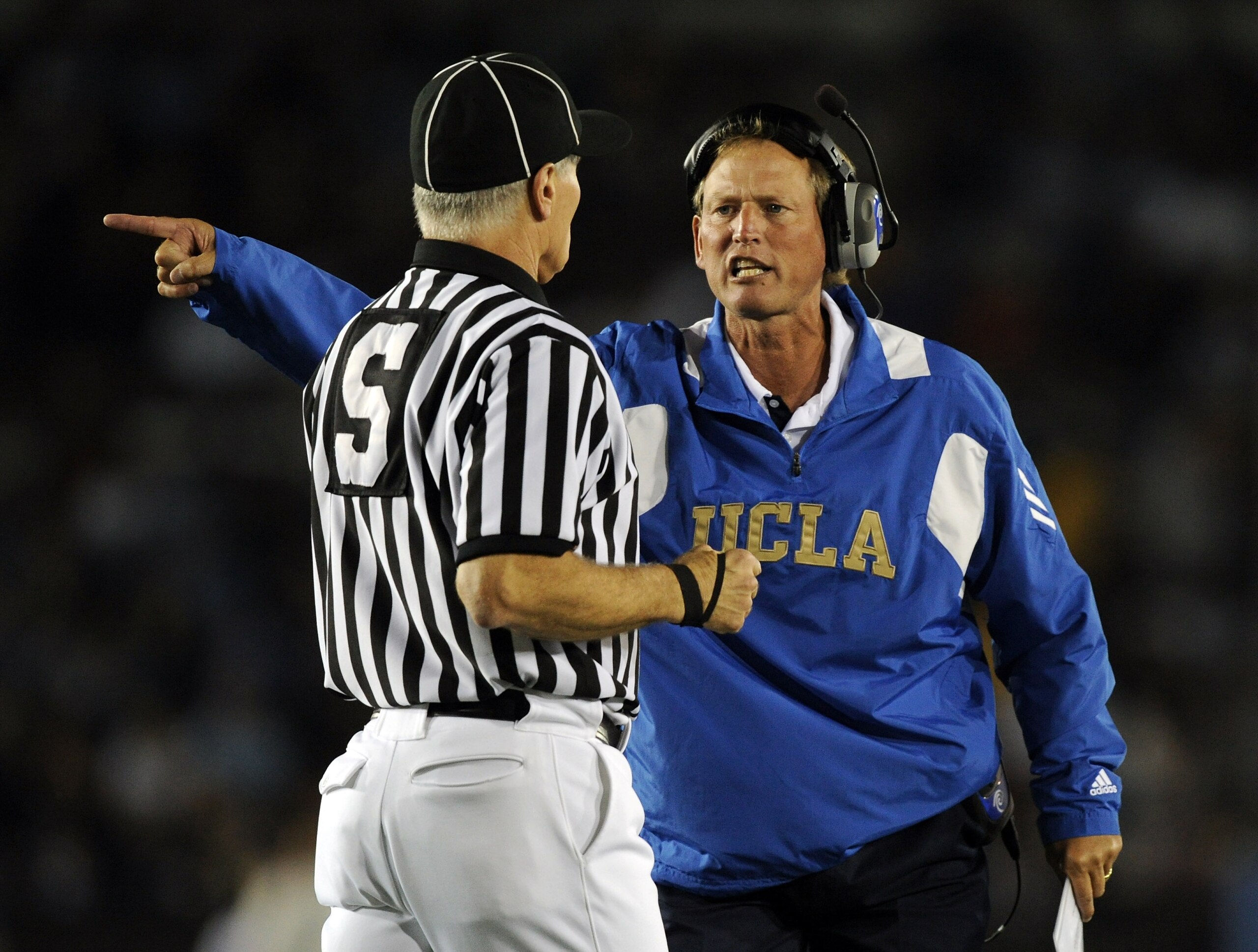 PASADENA, CA - SEPTEMBER 11: Head Coach Rick Neuheisel of UCLA yells at the referee during the second quarter against Stanford at the Rose Bowl on September 11, 2010 in Pasadena, California. (Photo by Harry How/Getty Images) PASADENA, CA - SEPTEMBER 11: Head Coach Rick Neuheisel of UCLA yells at the referee during the second quarter against Stanford at the Rose Bowl on September 11, 2010 in Pasadena, California. (Photo by Harry How/Getty Images)