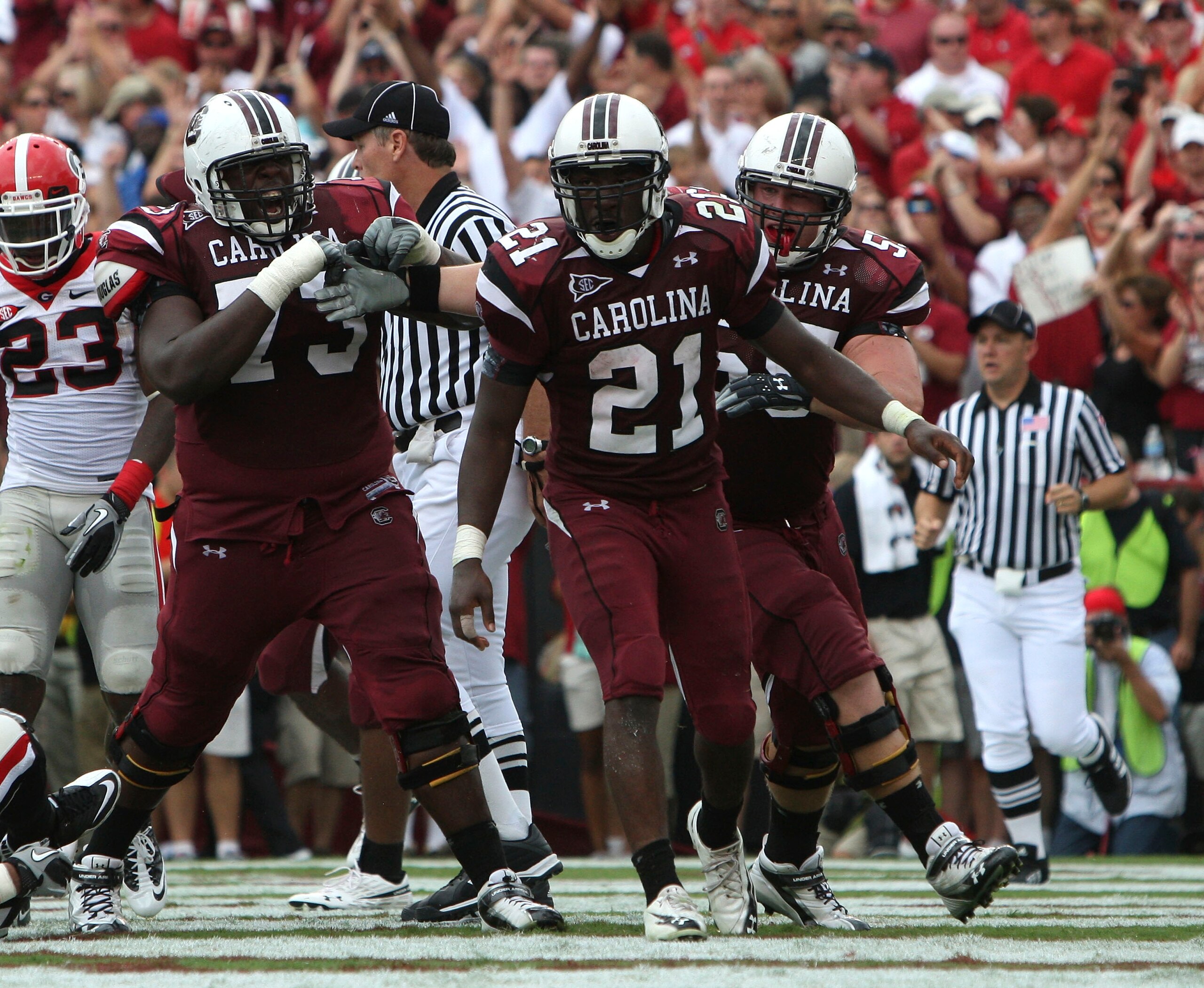 COLUMBIA, SC - SEPTEMBER 11: Tailback Marcus Lattimore #21 of the South Carolina Gamecocks celebrates with teammates after his second quarter touchdown during the game against the Georgia Bulldogs at Williams-Brice Stadium on September 11, 2010 in Columbi