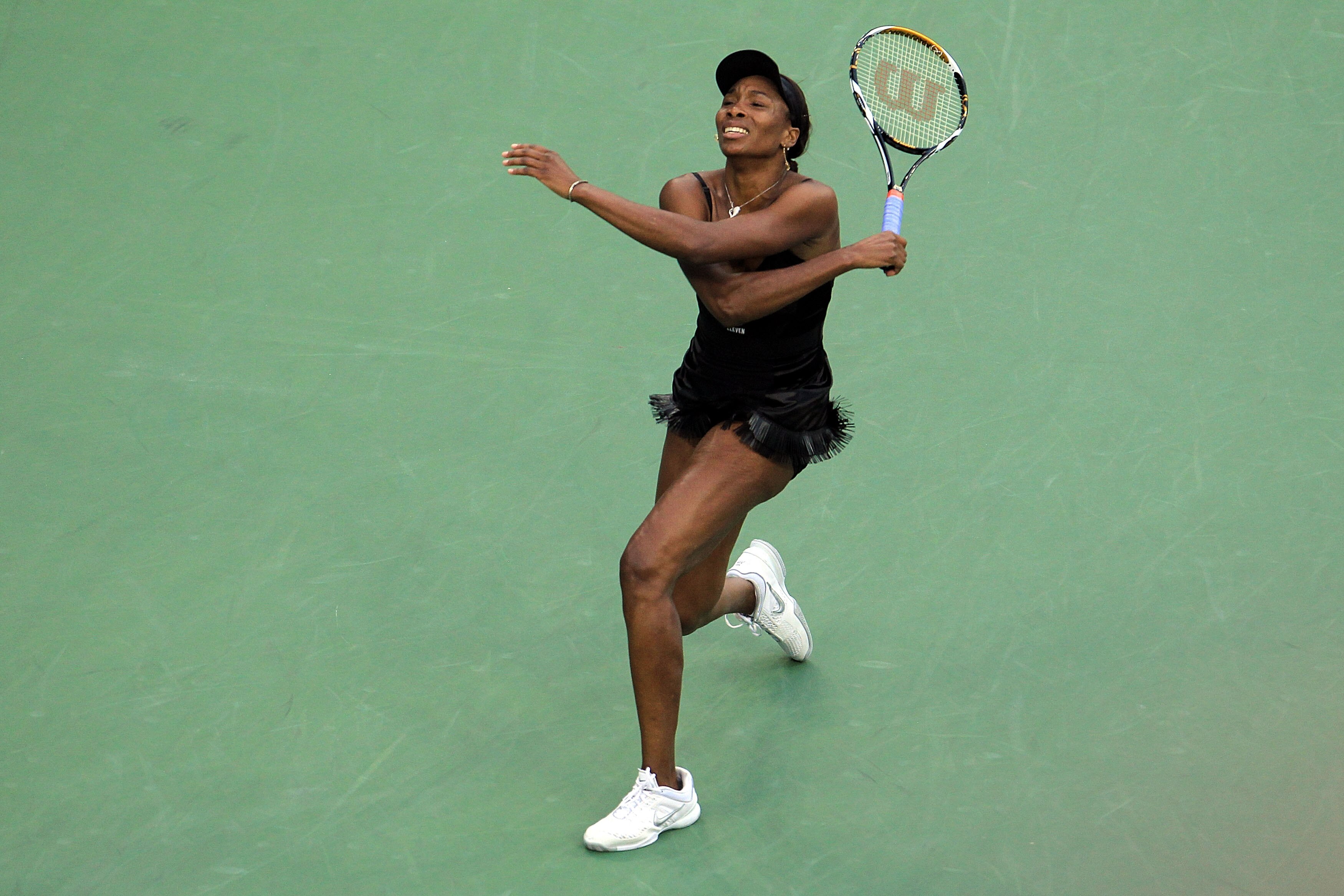 NEW YORK - SEPTEMBER 10:  Venus Williams of the United States reacts after a point played against Kim Clijsters of Belgium during her women's semifinal match on day twelve of the 2010 U.S. Open at the USTA Billie Jean King National Tennis Center on Septem