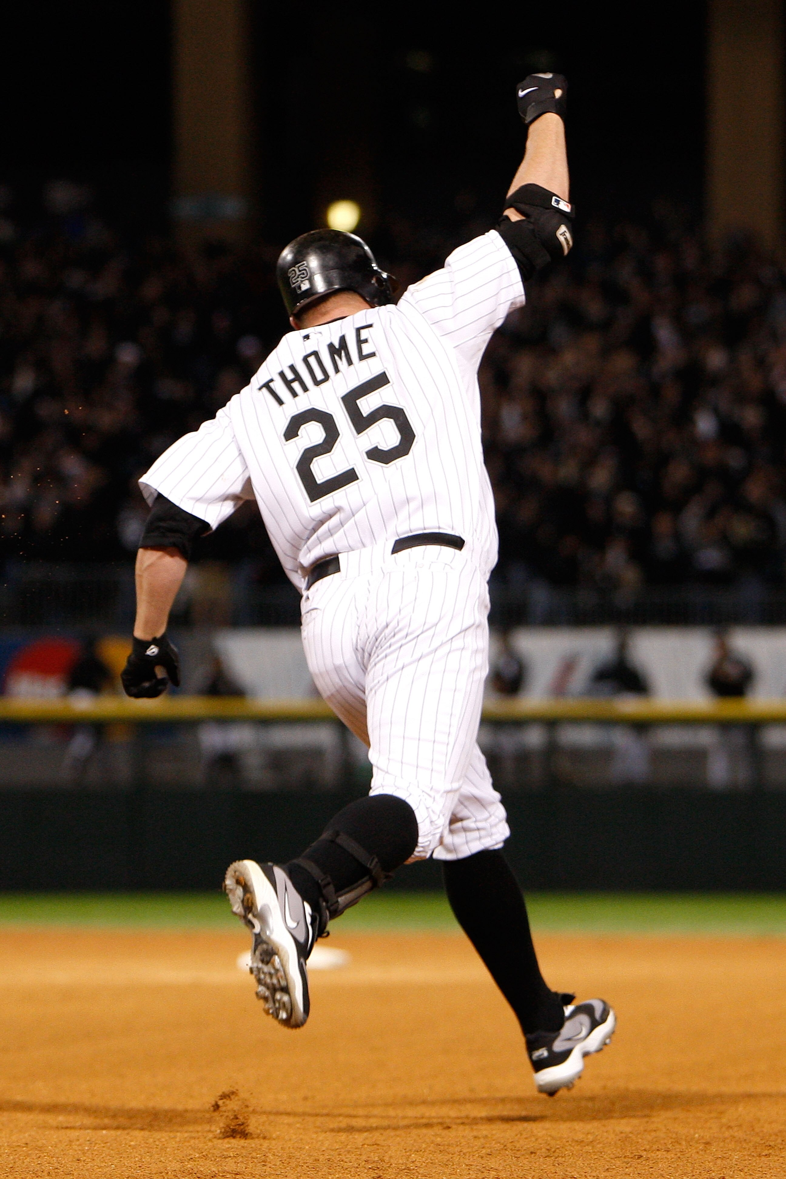 CHICAGO - SEPTEMBER 30:  Jim Thome #25 of the Chicago White Sox celebrates as he runs the bases after hitting a solo home run to give the White Sox a 1-0 lead in the bottom of the seventh inning against the Minnesota Twins during the American League Centr