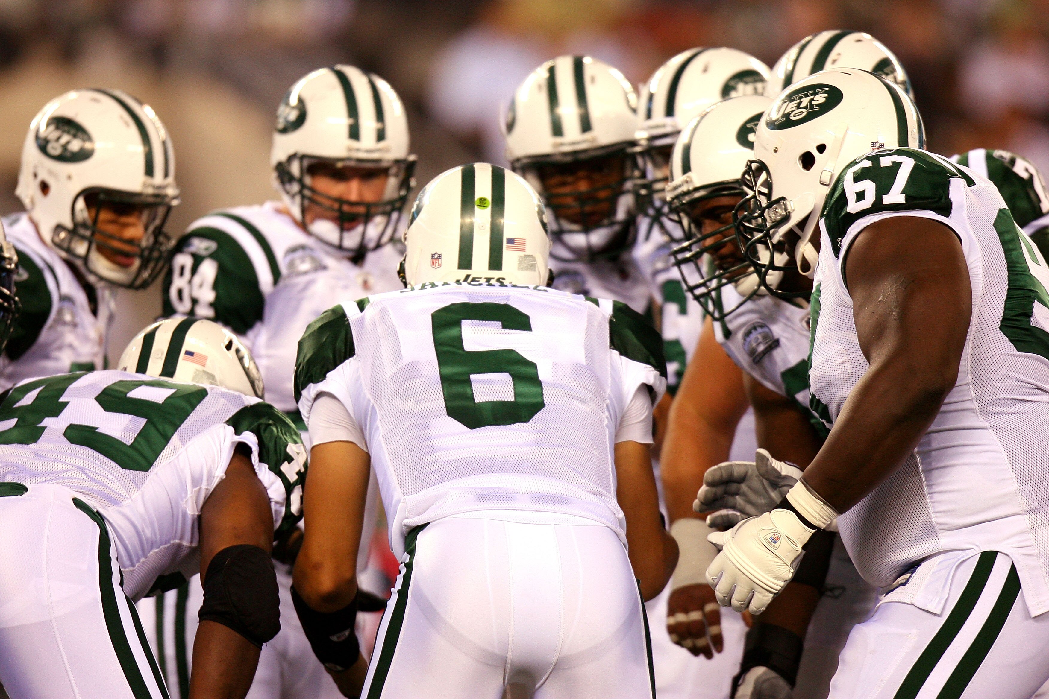 EAST RUTHERFORD, NJ - SEPTEMBER 13:  Mark Sanchez #6 of the New York Jets talks to his teammates in a huddle against the Baltimore Ravens during their home opener at the New Meadowlands Stadium on September 13, 2010 in East Rutherford, New Jersey.  (Photo