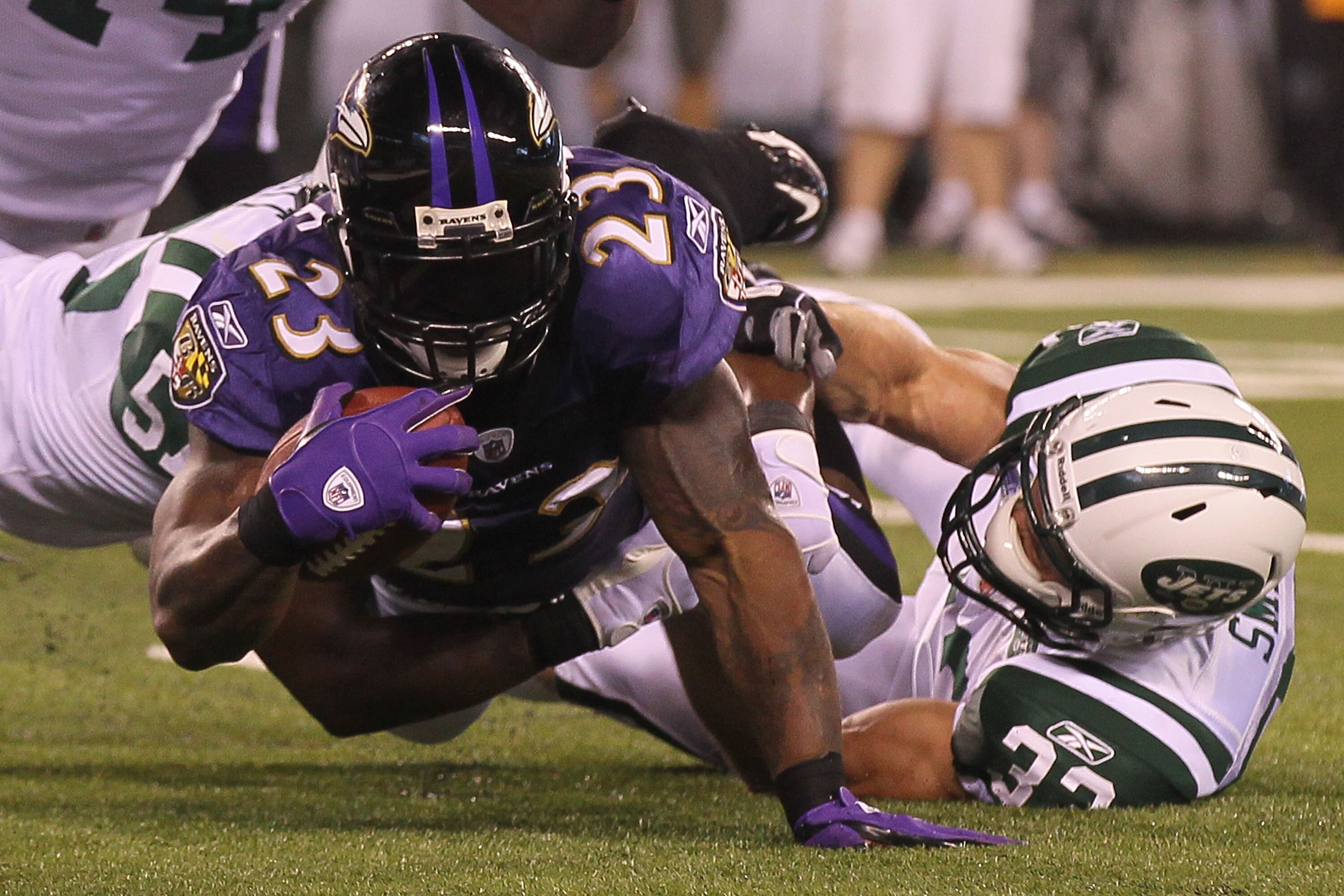 EAST RUTHERFORD, NJ - SEPTEMBER 13:  Willis McGahee #23 of the Baltimore Ravens gets tackeled by the New York Jets during their home opener at the New Meadowlands Stadium on September 13, 2010 in East Rutherford, New Jersey.  (Photo by Jim McIsaac/Getty I