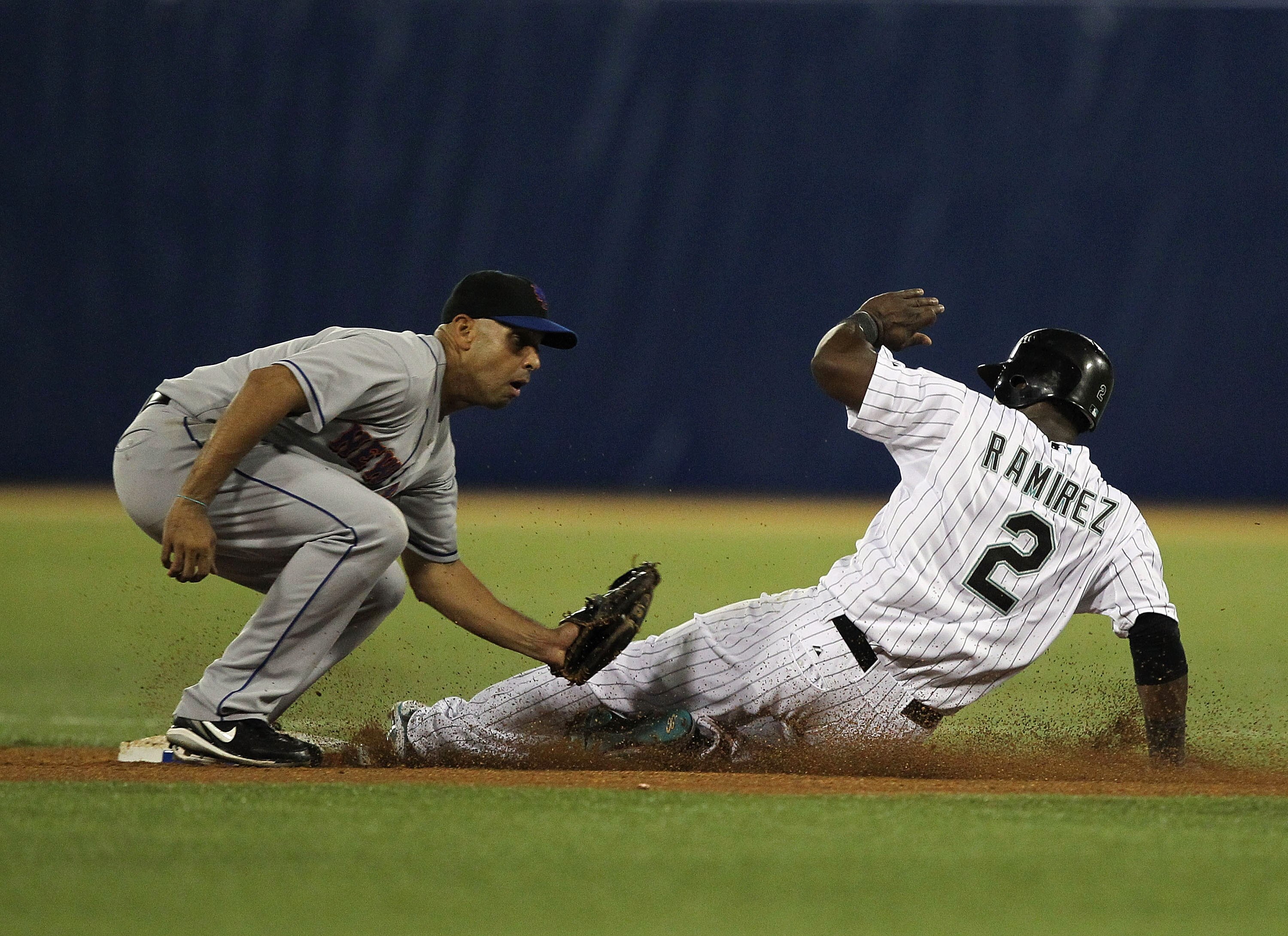 SAN JUAN, PUERTO RICO - JUNE 30:  Alex Cora #13 of the New York Mets is late with the tag as Hanley Ramirez #2 of the Florida Marlins steals second base during their game at Hiram Bithorn Stadium on June 30, 2010 in San Juan, Puerto Rico.  (Photo by Al Be