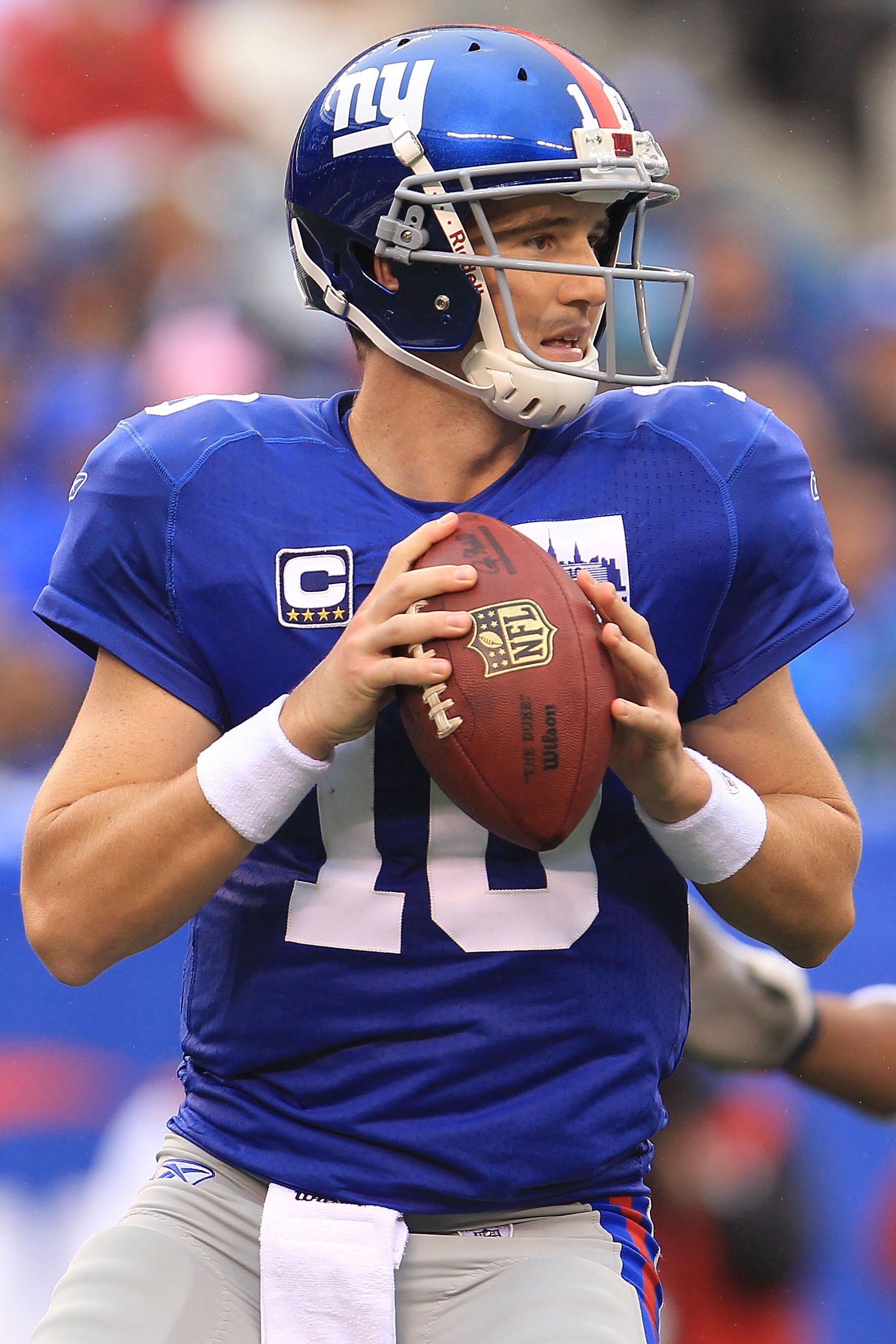 EAST RUTHERFORD, NJ - SEPTEMBER 12:  Eli Manning #10 of the New York Giants looks to pass  against the Carolina Panthers during the NFL season opener at New Meadowlands Stadium on September 12, 2010 in East Rutherford, New Jersey.  (Photo by Chris McGrath