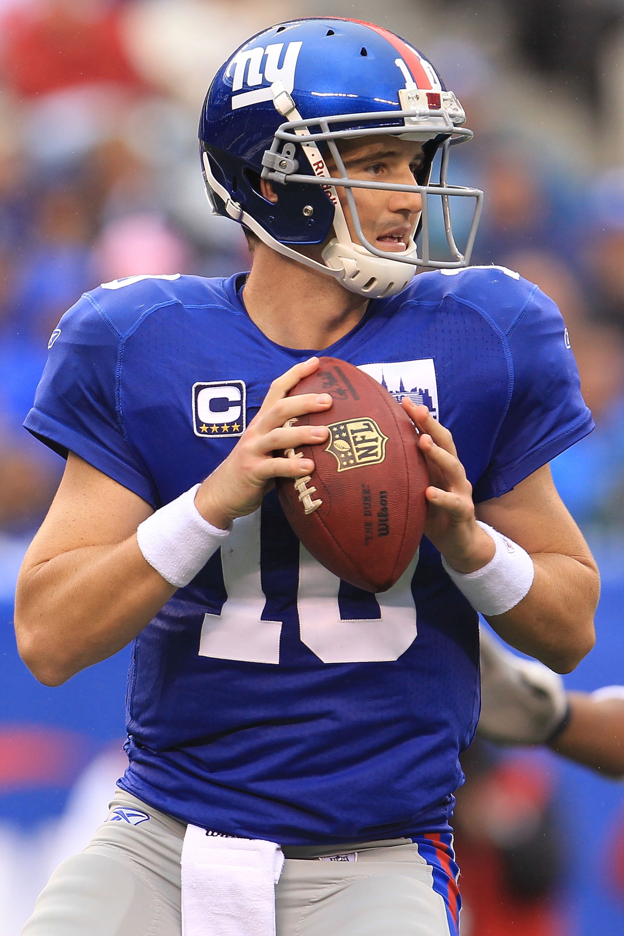 EAST RUTHERFORD, NJ - SEPTEMBER 12:  Eli Manning #10 of the New York Giants looks to pass  against the Carolina Panthers during the NFL season opener at New Meadowlands Stadium on September 12, 2010 in East Rutherford, New Jersey.  (Photo by Chris McGrath
