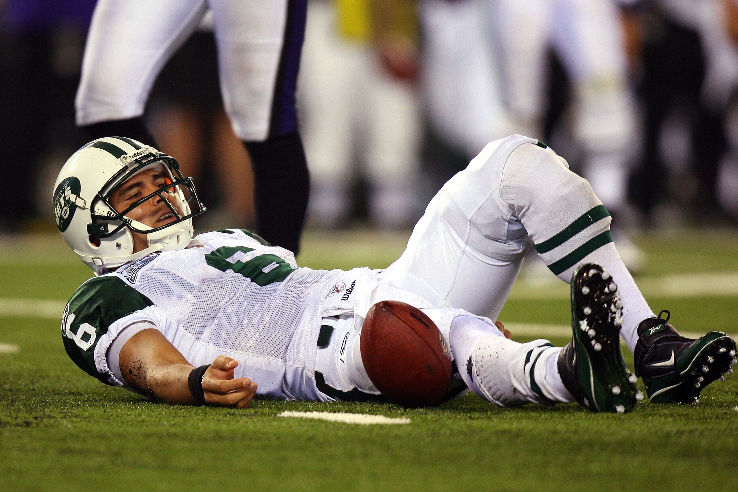 EAST RUTHERFORD, NJ - SEPTEMBER 13: Mark Sanchez #6 of the New York Jets lays on the ground after a sack in the fourth quarter by the Baltimore Ravens during their home opener at the New Meadowlands Stadium on September 13, 2010 in East Rutherford, New J EAST RUTHERFORD, NJ - SEPTEMBER 13: Mark Sanchez #6 of the New York Jets lays on the ground after a sack in the fourth quarter by the Baltimore Ravens during their home opener at the New Meadowlands Stadium on September 13, 2010 in East Rutherford, New J