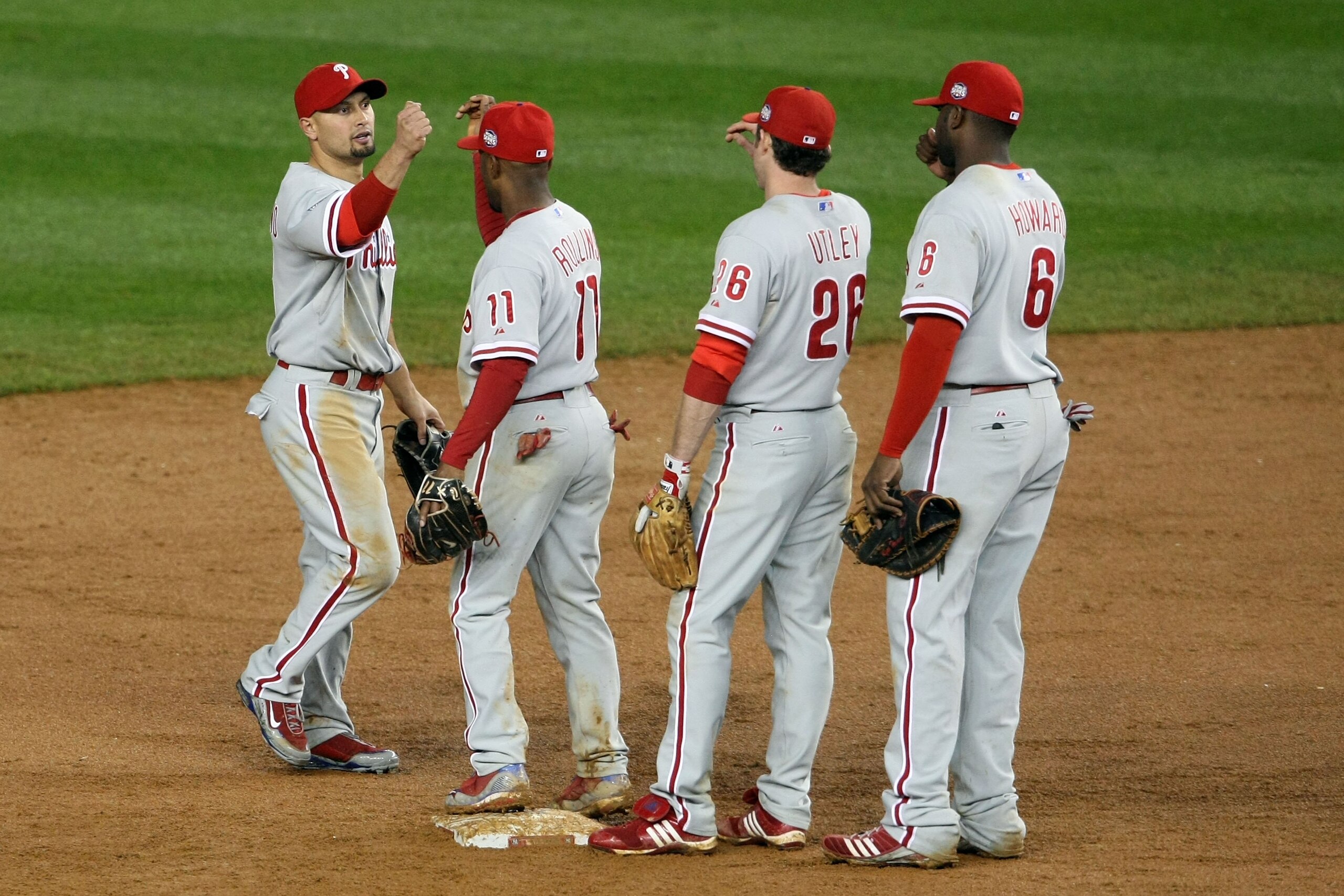 NEW YORK - OCTOBER 28:  (L-R) Shane Victorino #8, Jimmy Rollins #11, Chase Utley #26 and Ryan Howard #6 of the Philadelphia Phillies celebrate after their 6-1 win against the New York Yankees in Game One of the 2009 MLB World Series at Yankee Stadium on O