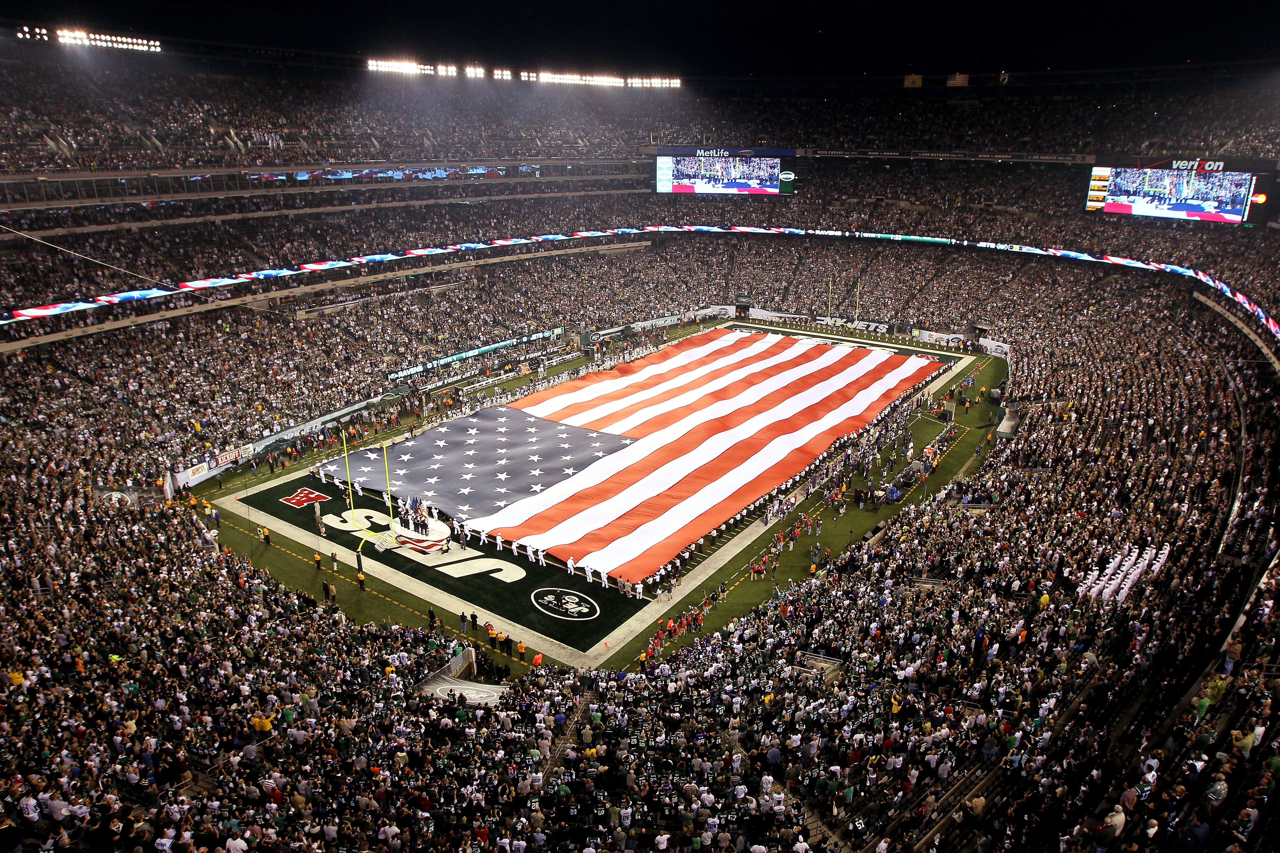 EAST RUTHERFORD, NJ - SEPTEMBER 13: The American flag waves duirng the national anthem prior to the New York Jets playing the Baltimore Ravens in their home opener at the New Meadowlands Stadium on September 13, 2010 in East Rutherford, New Jersey.  (Phot